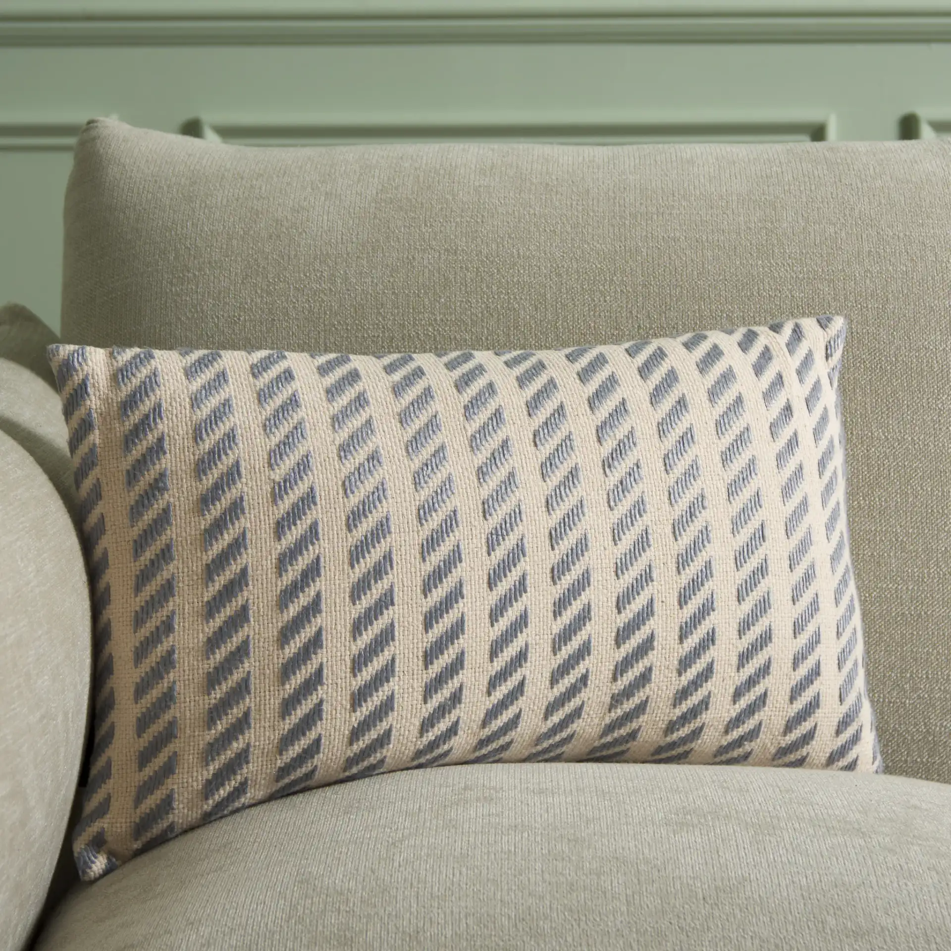 Suki Pillow in Natural / Gray in a styled room