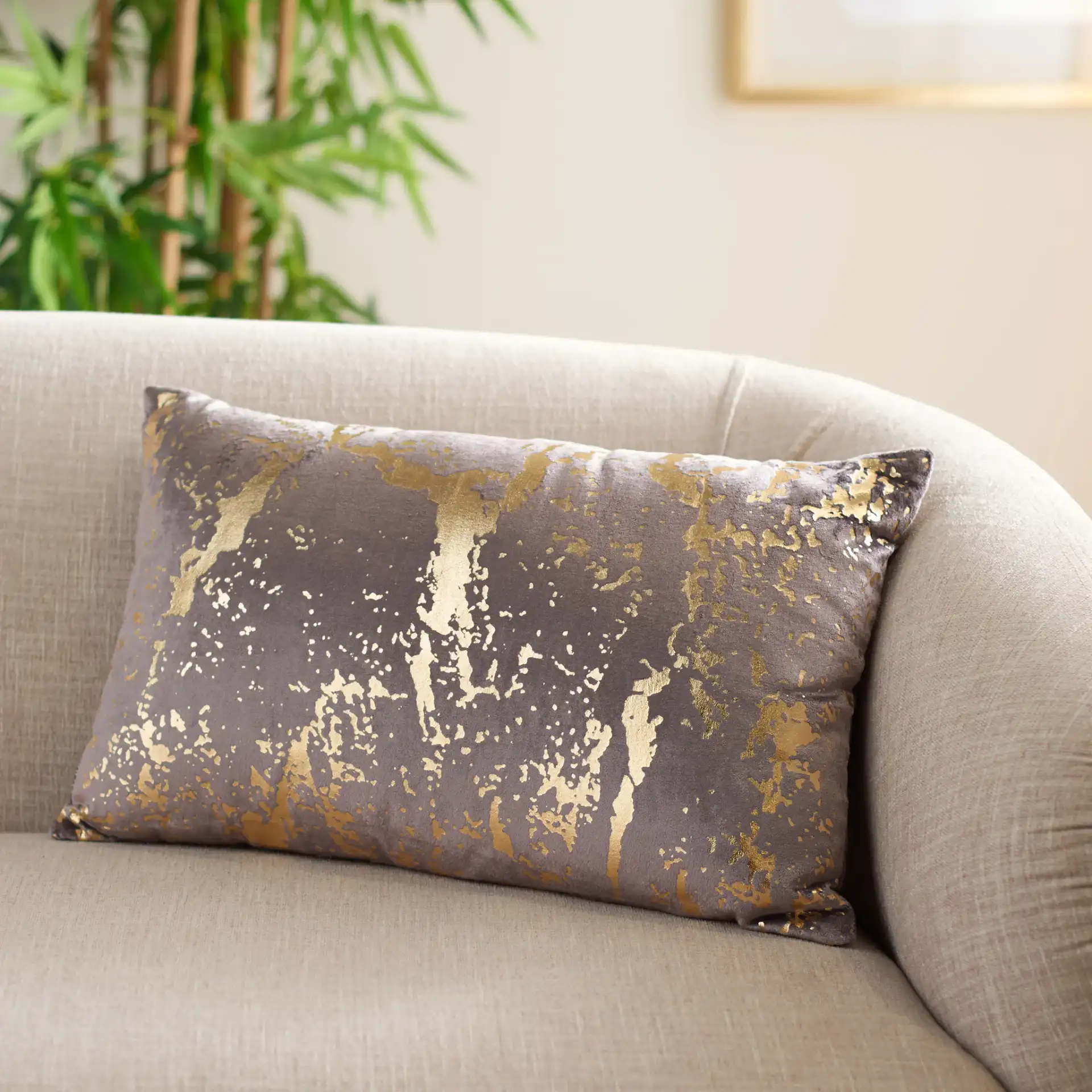 Pari Pillow in Brown / Gold Foil in a styled room