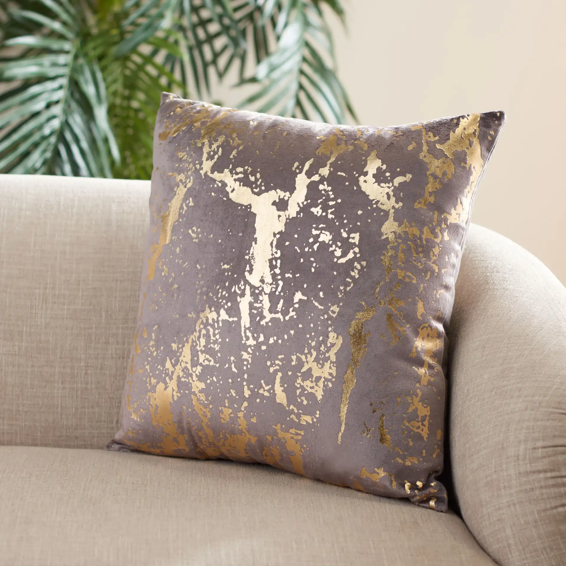 Pari Pillow in Brown / Gold Foil in a styled room