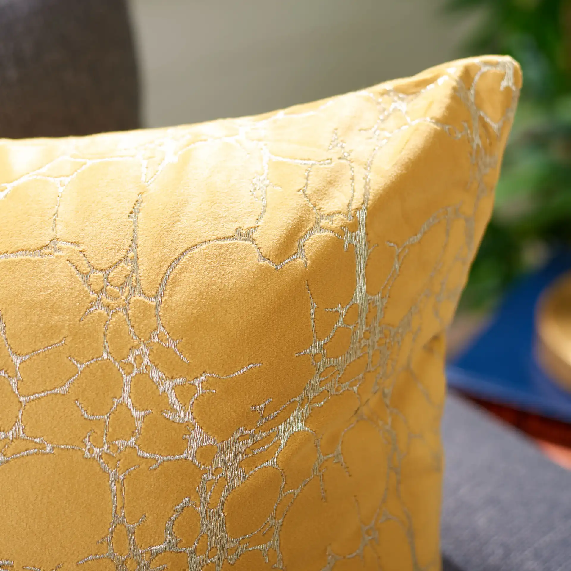 Brenla Pillow in Dark Green in a styled room