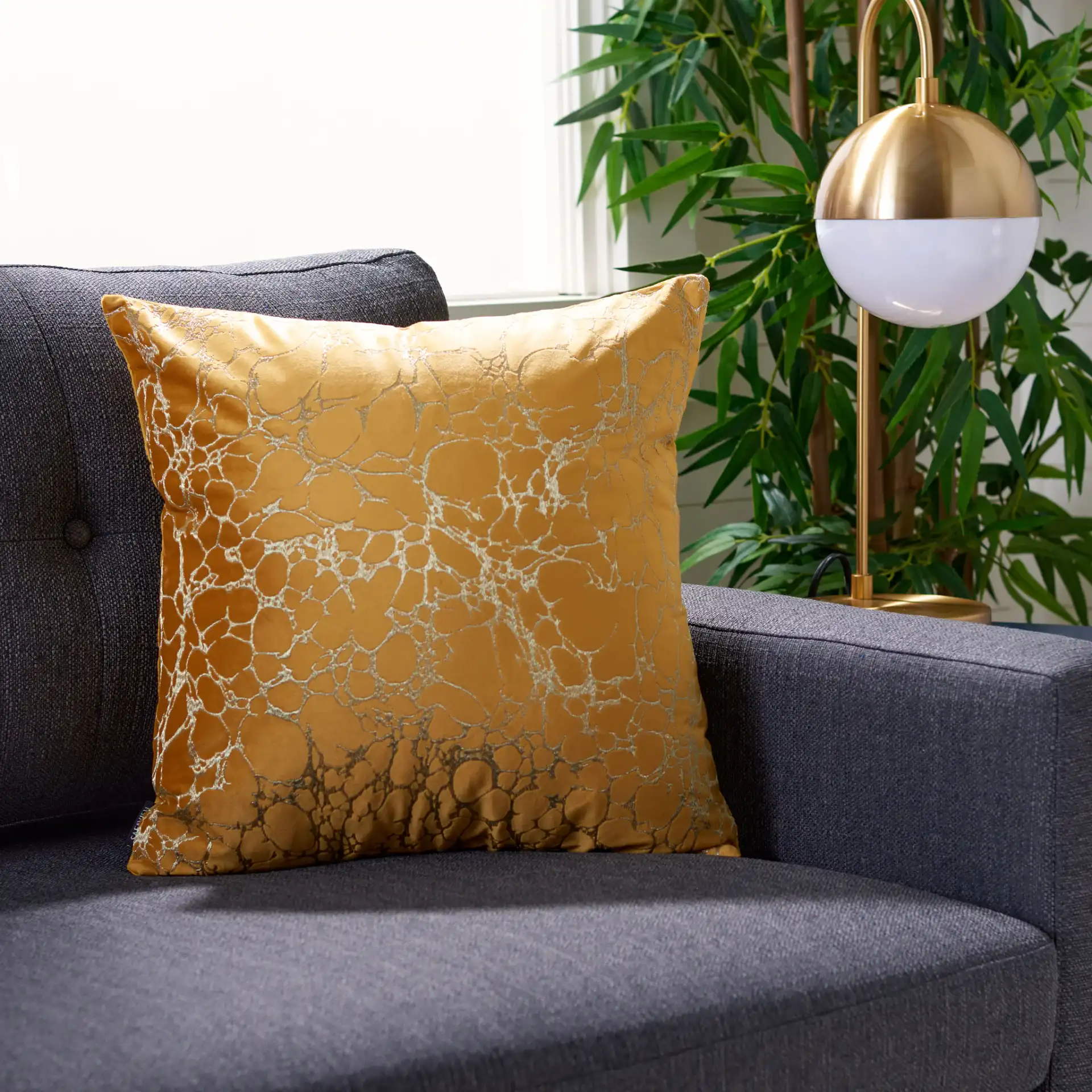 Brenla Pillow in Dark Green in a styled room
