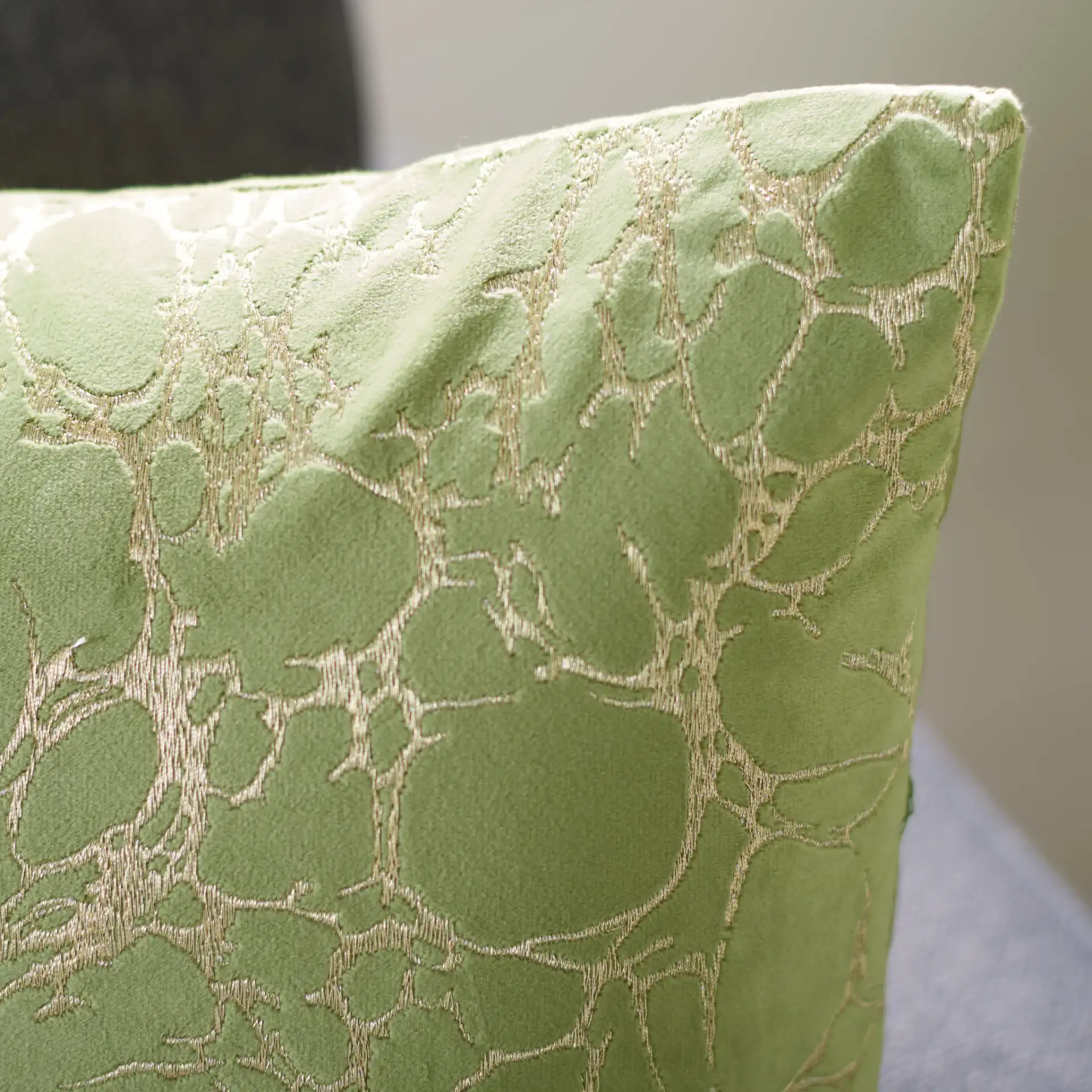 Brenla Pillow in Dark Green in a styled room