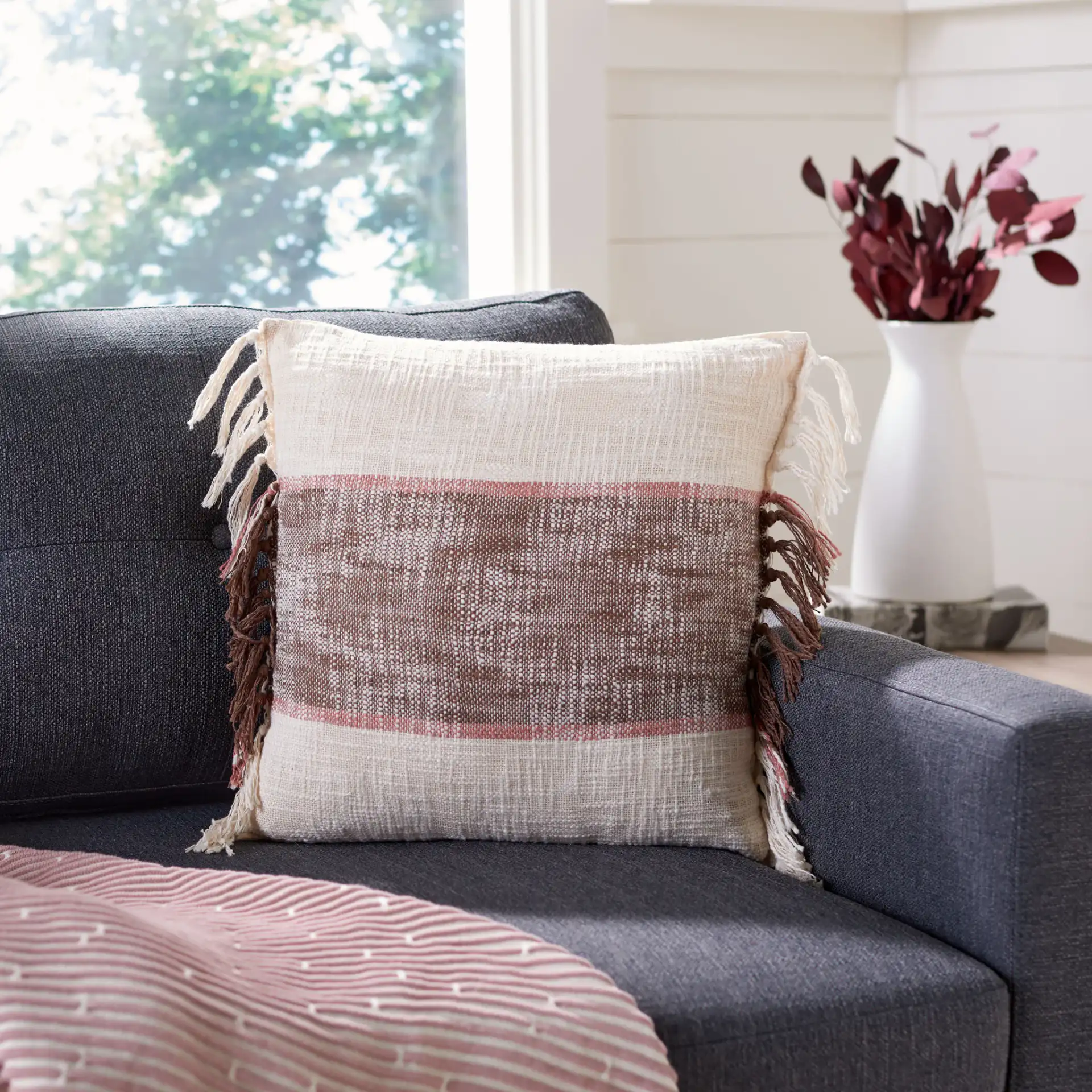 Lencia Pillow in Beige / Gray in a styled room