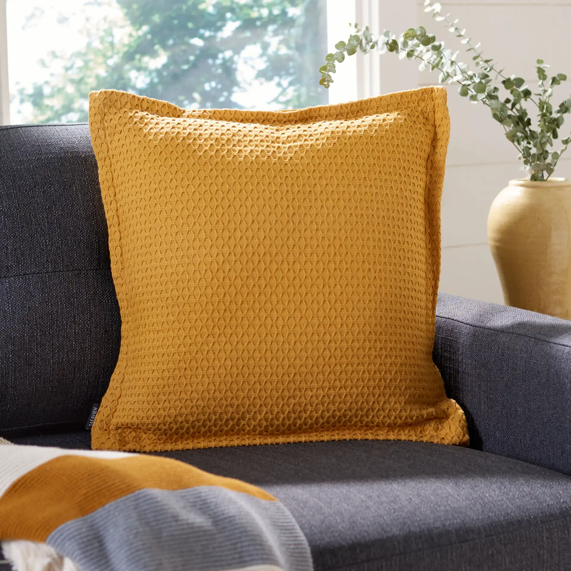 Lucina Pillow in Yellow in a styled room