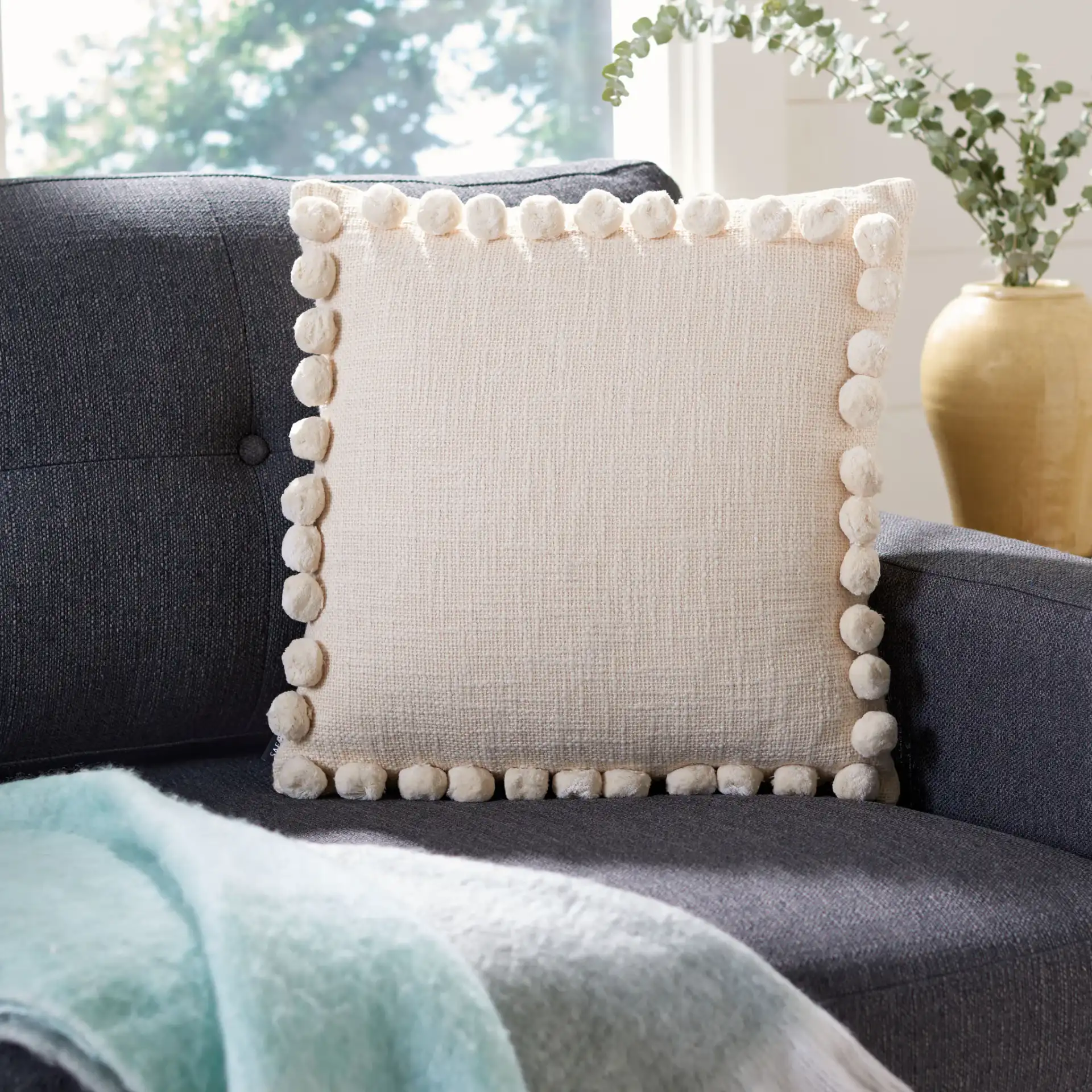 Zelina Pillow in Beige in a styled room