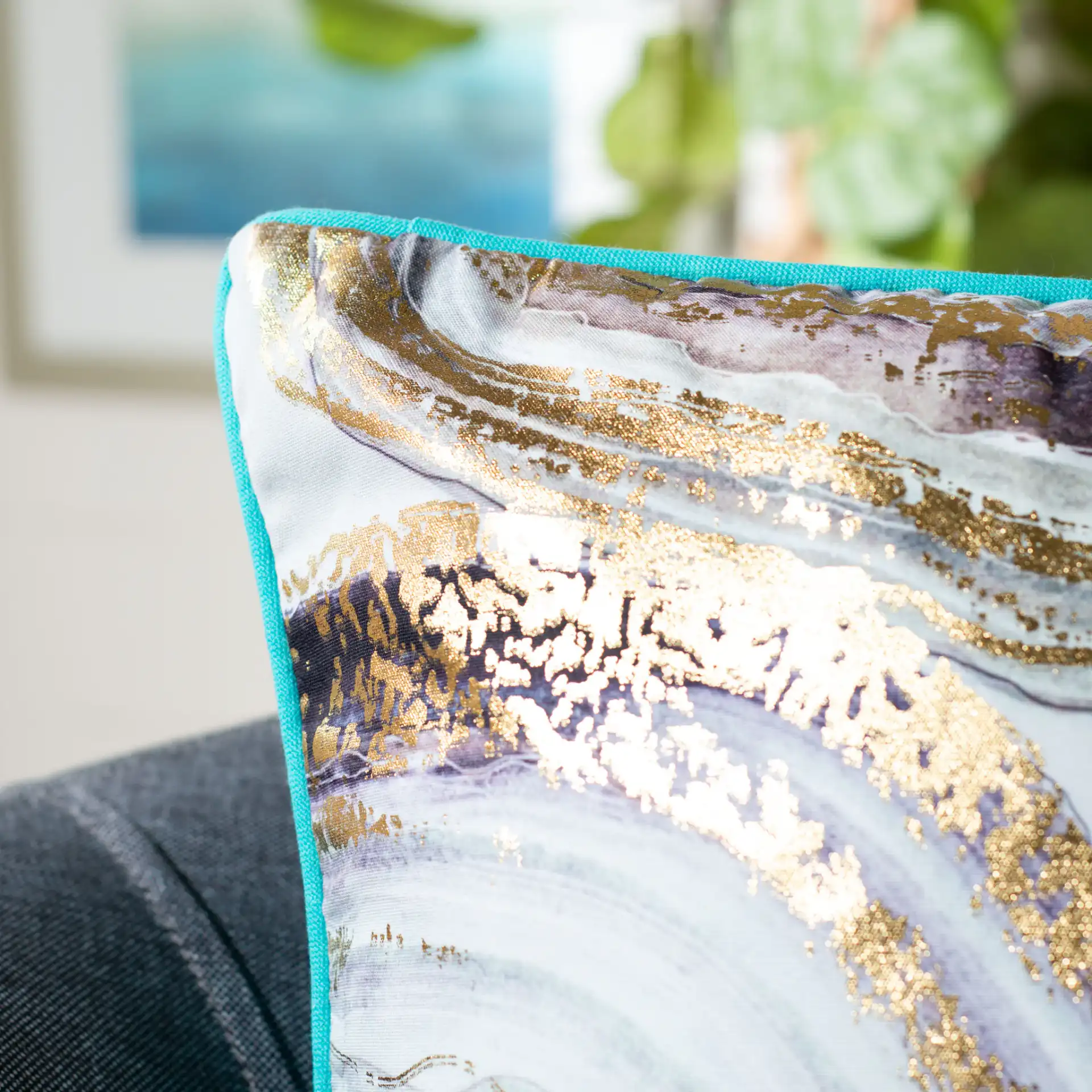 Nima Pillow in Blue / Gold in a styled room
