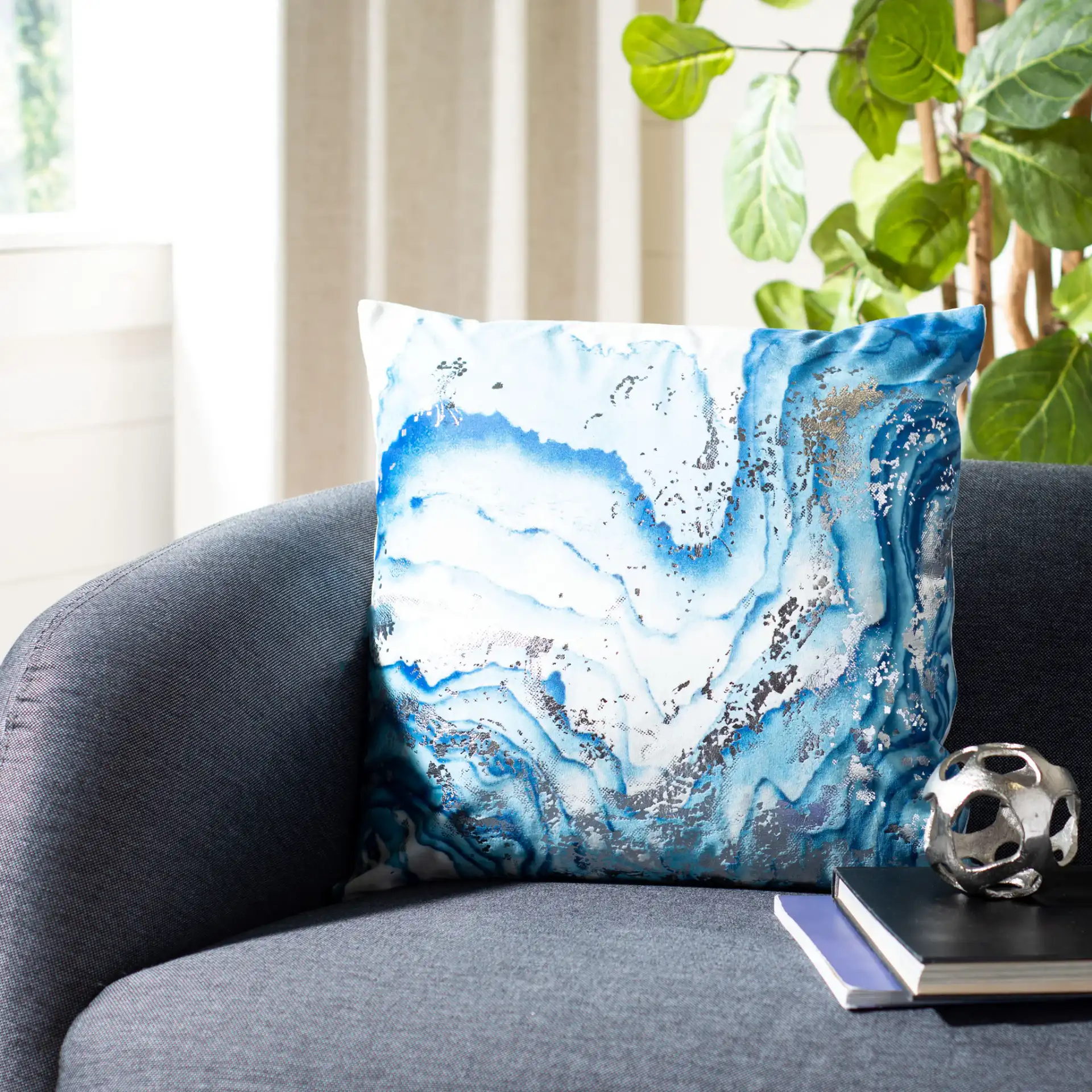 Jakki Pillow in White / Blue in a styled room