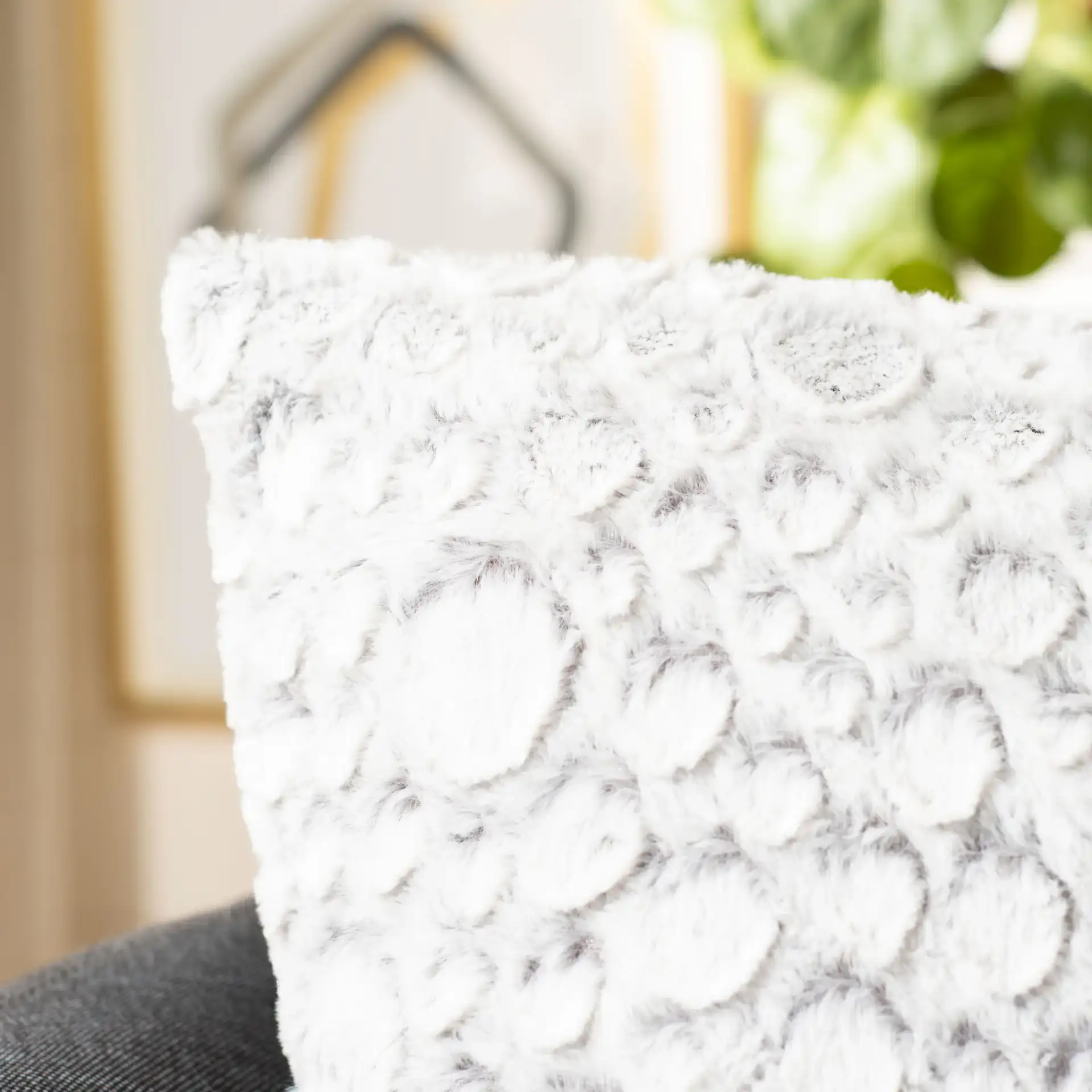 Kiana Pillow in White / Gray in a styled room