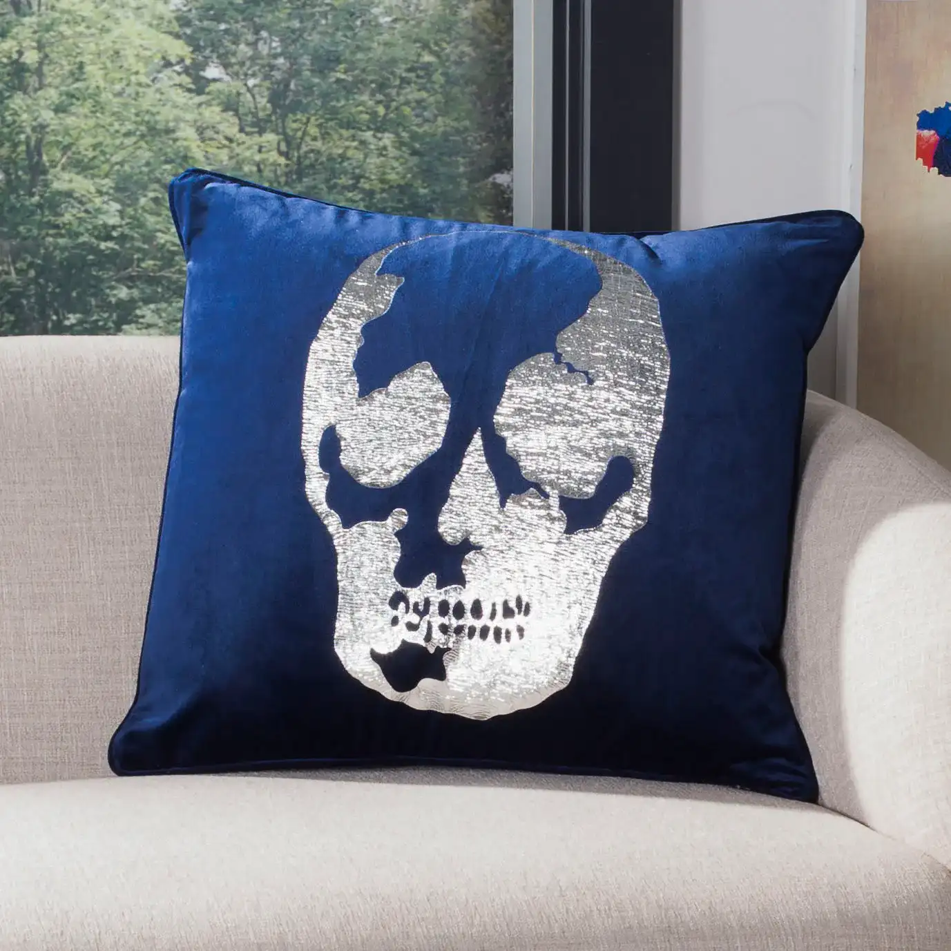 Rayen Skull Pillow in Dark Blue / Silver in a styled room