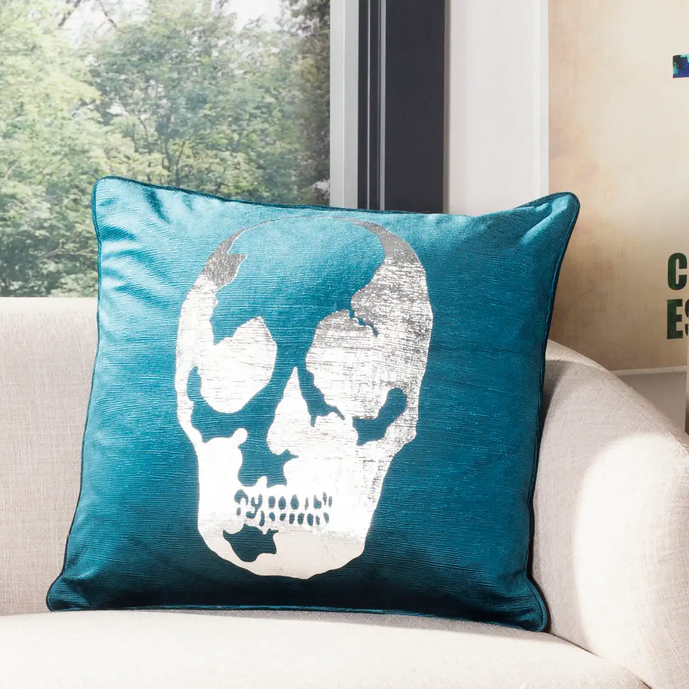 Romey Skull Pillow in Dark Green in a styled room