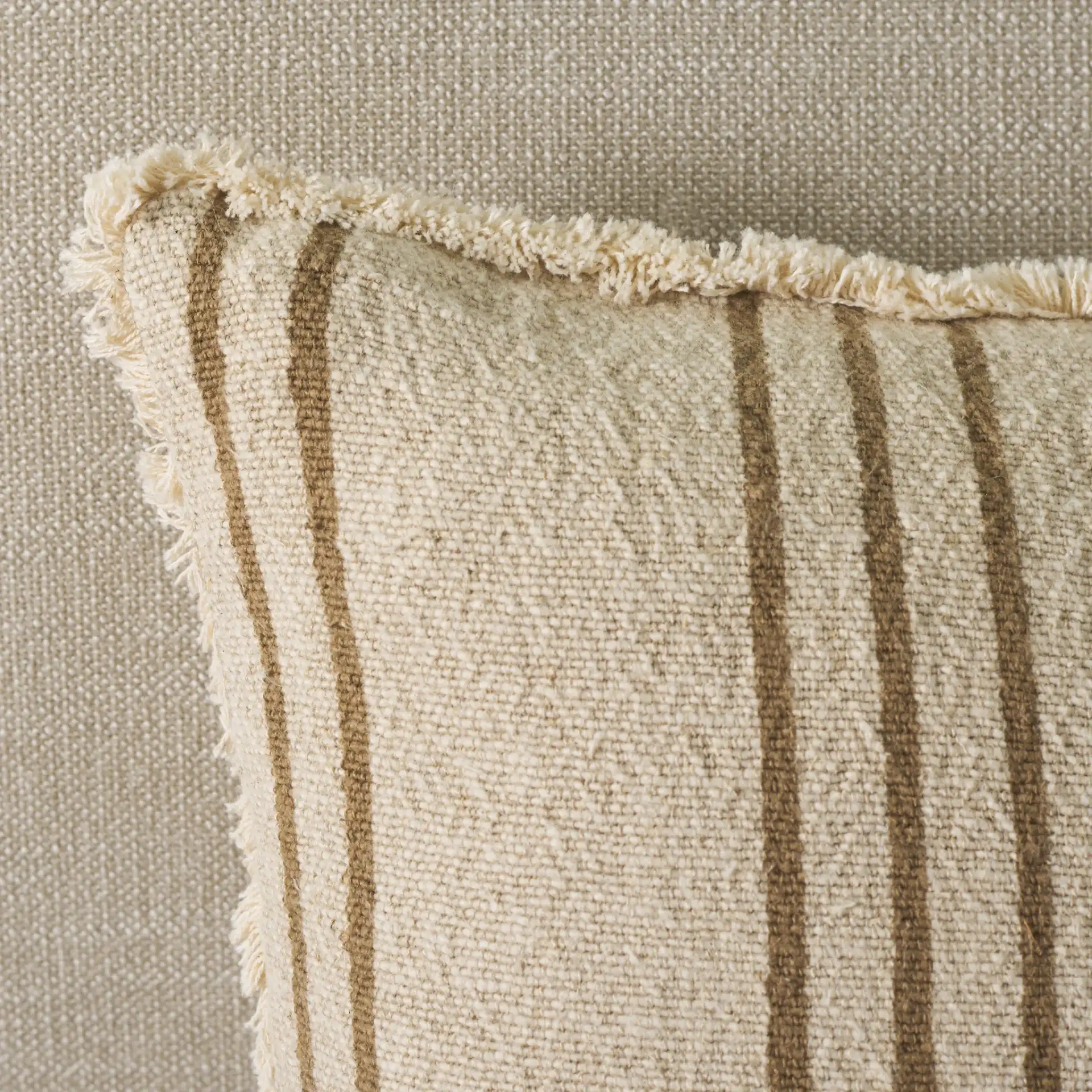 Rory Pillow in Tan / Natural in a styled room