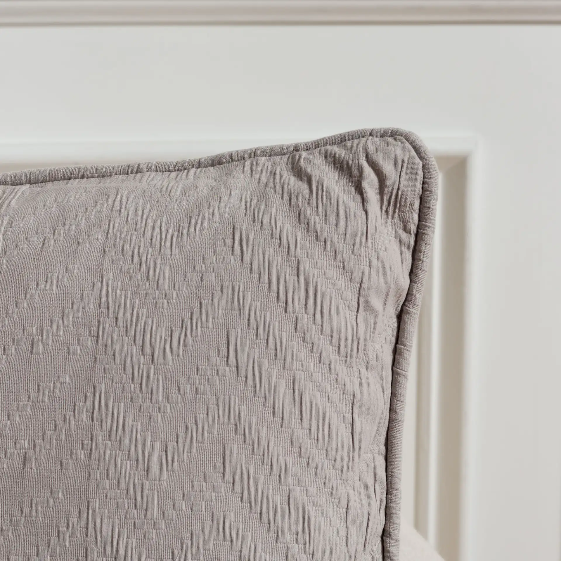 Faina Pillow in Gray in a styled room