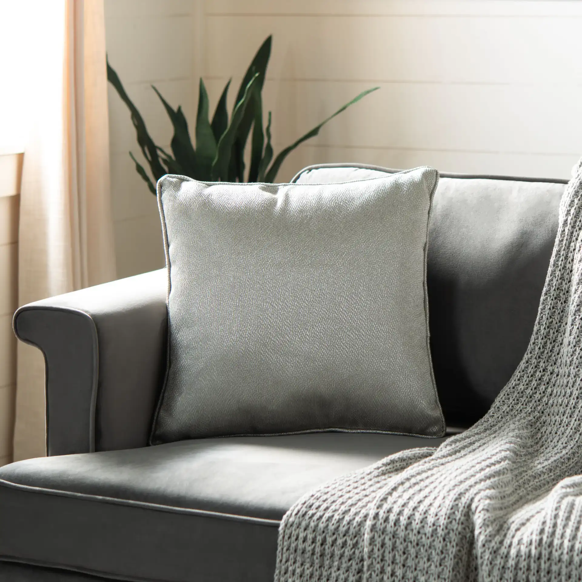 Raelyn Pillow in Light Gray in a styled room