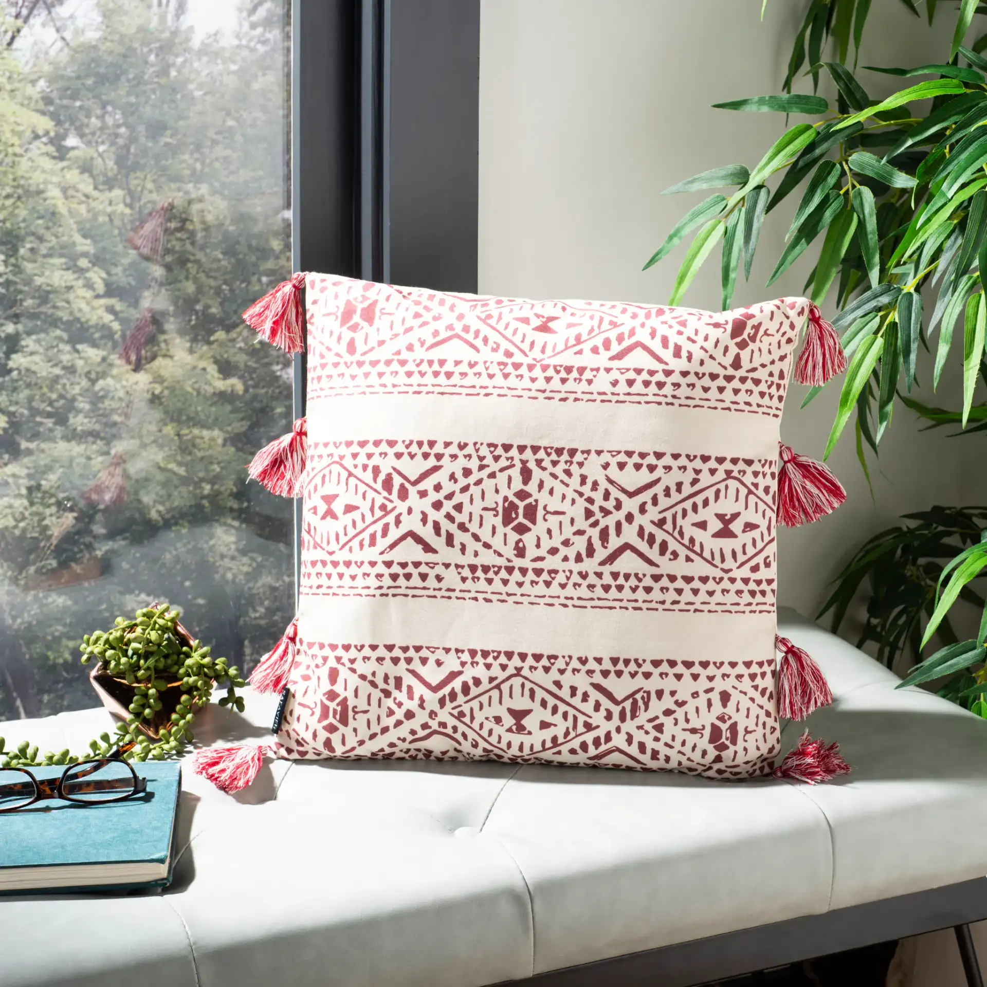 Landria Pillow in Beige / Red in a styled room