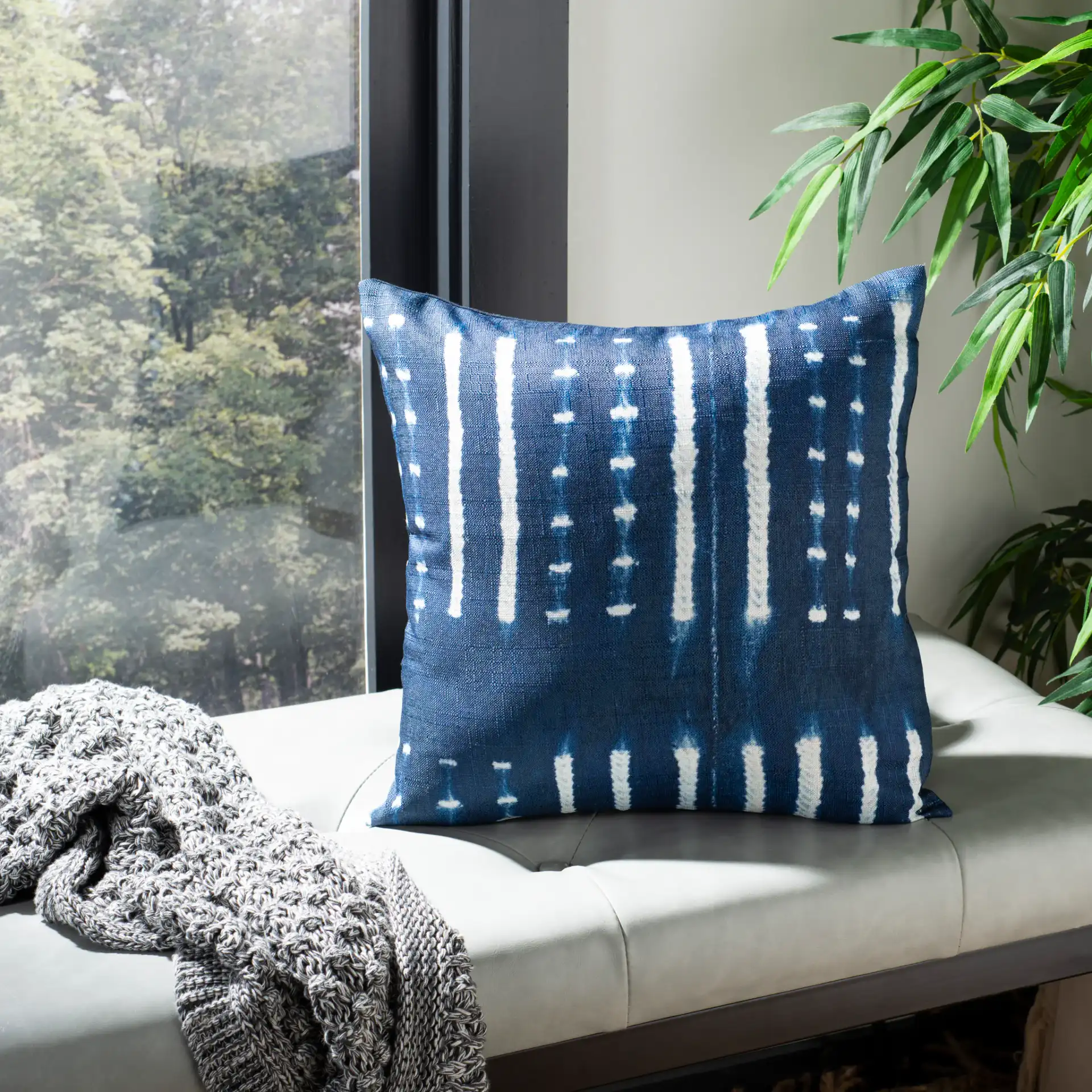 Narla Pillow in Deep Blue / White in a styled room