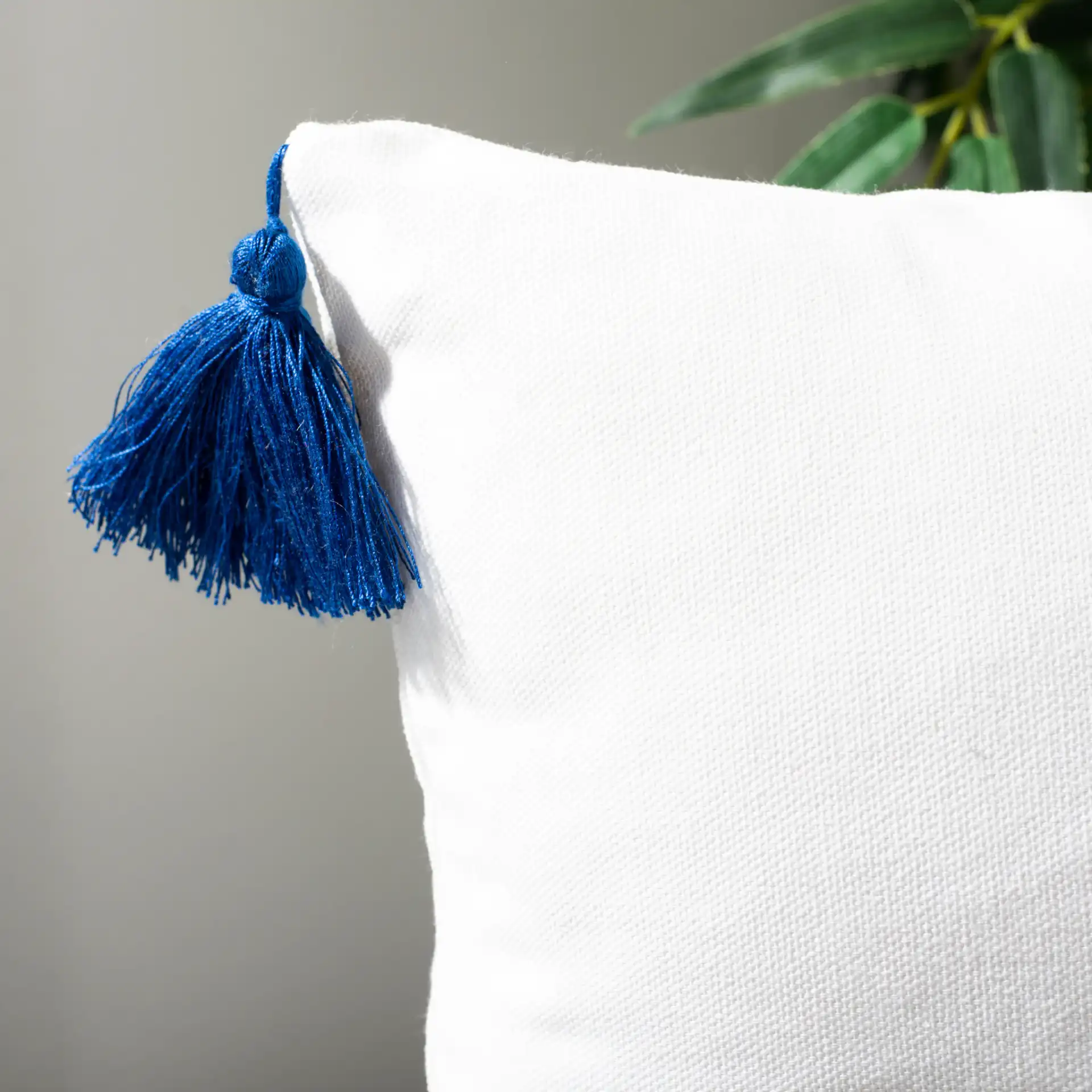 Orlanda Pillow in White / Navy Blue in a styled room