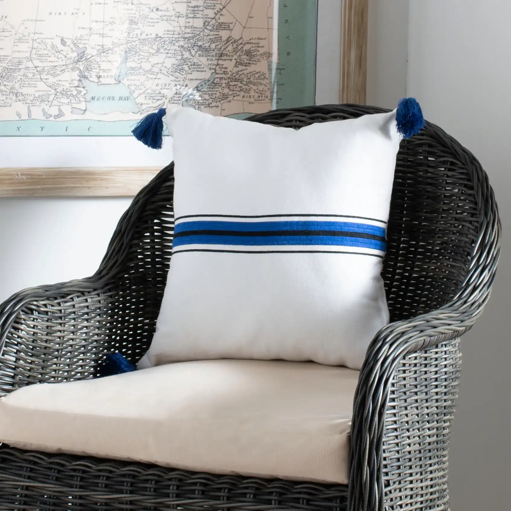 Orlanda Pillow in White / Navy Blue in a styled room