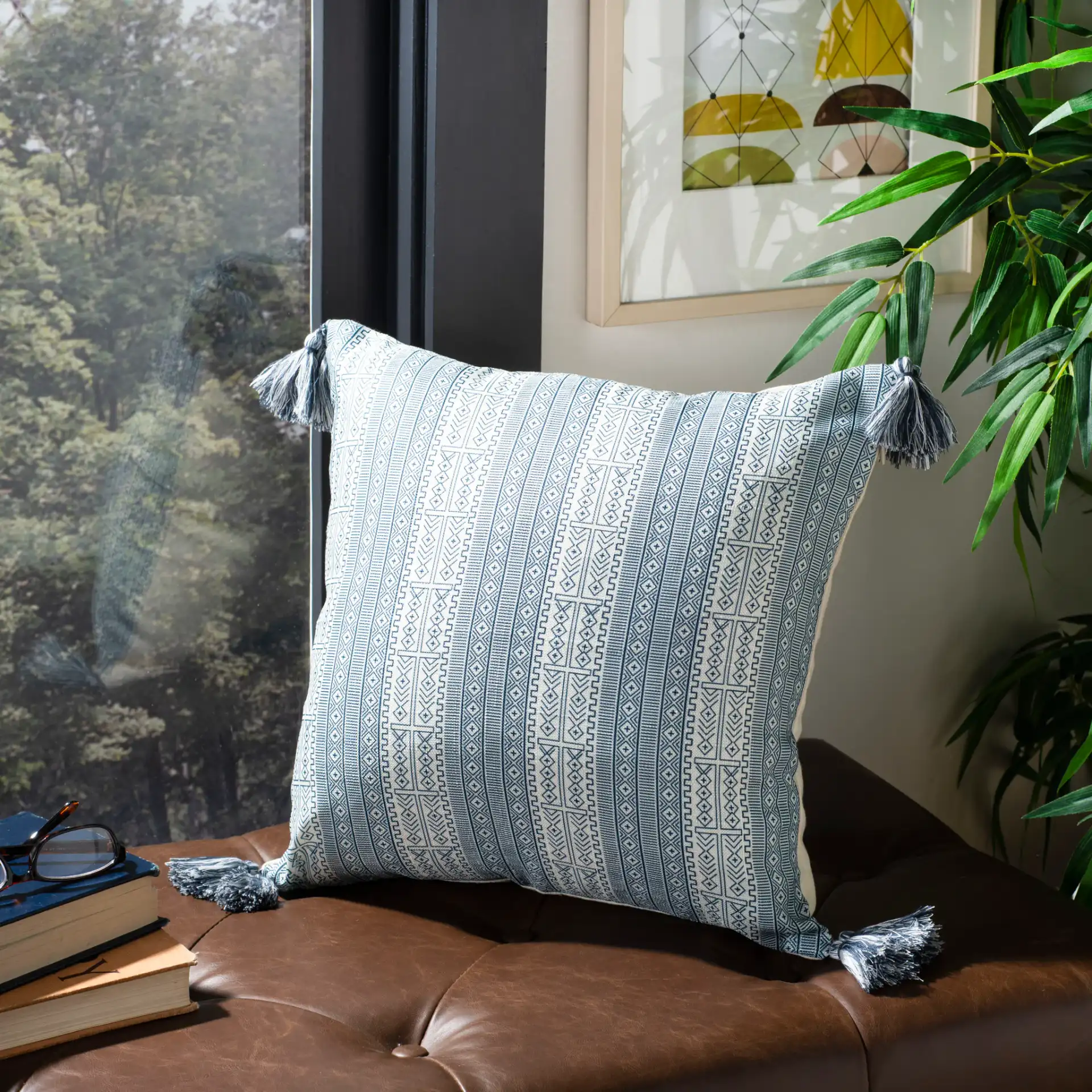 Lunette Pillow in White / Blue in a styled room
