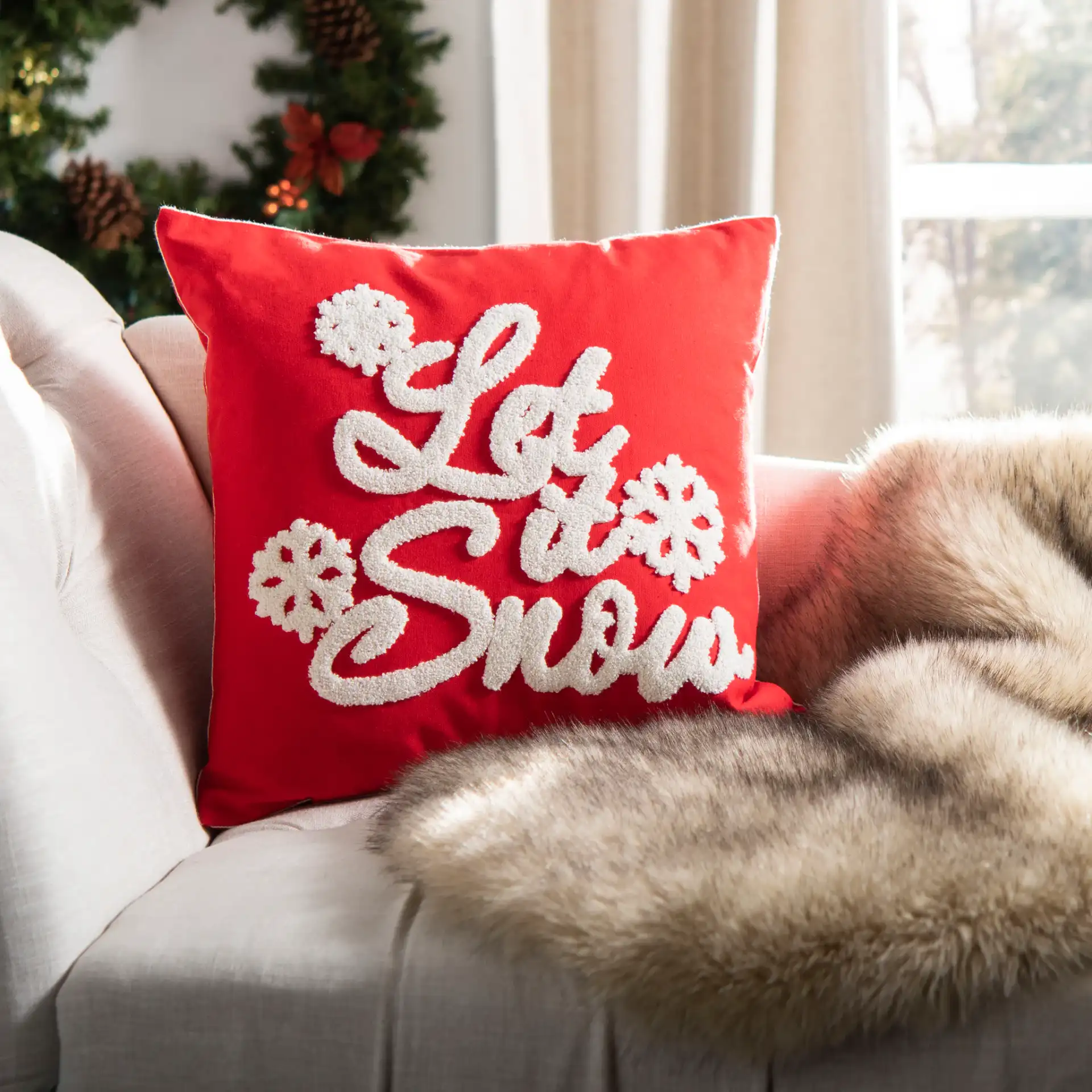 Let It Snow Pillow in Red / White in a styled room