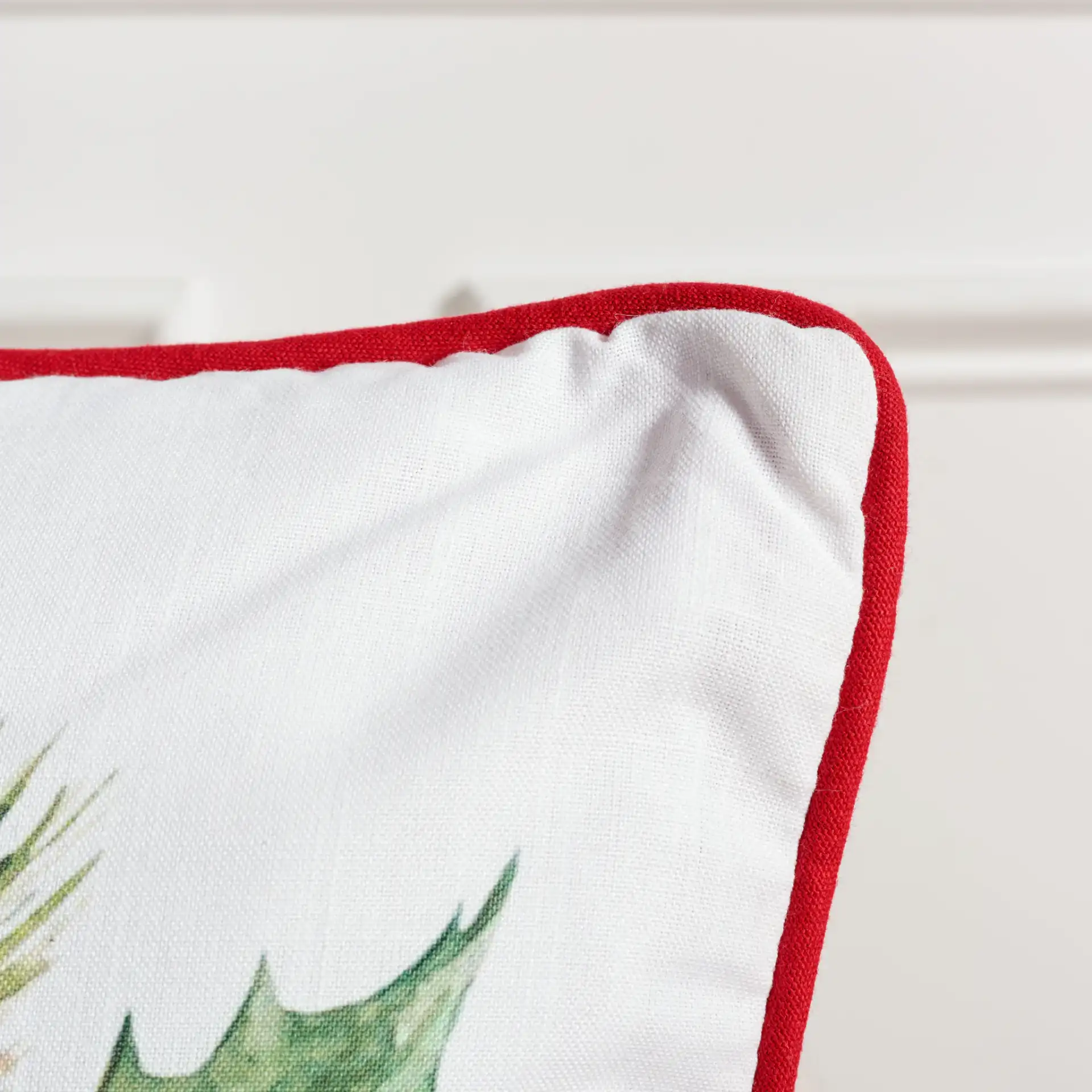 Gwendolen Pillow in Beige / Red / Green in a styled room