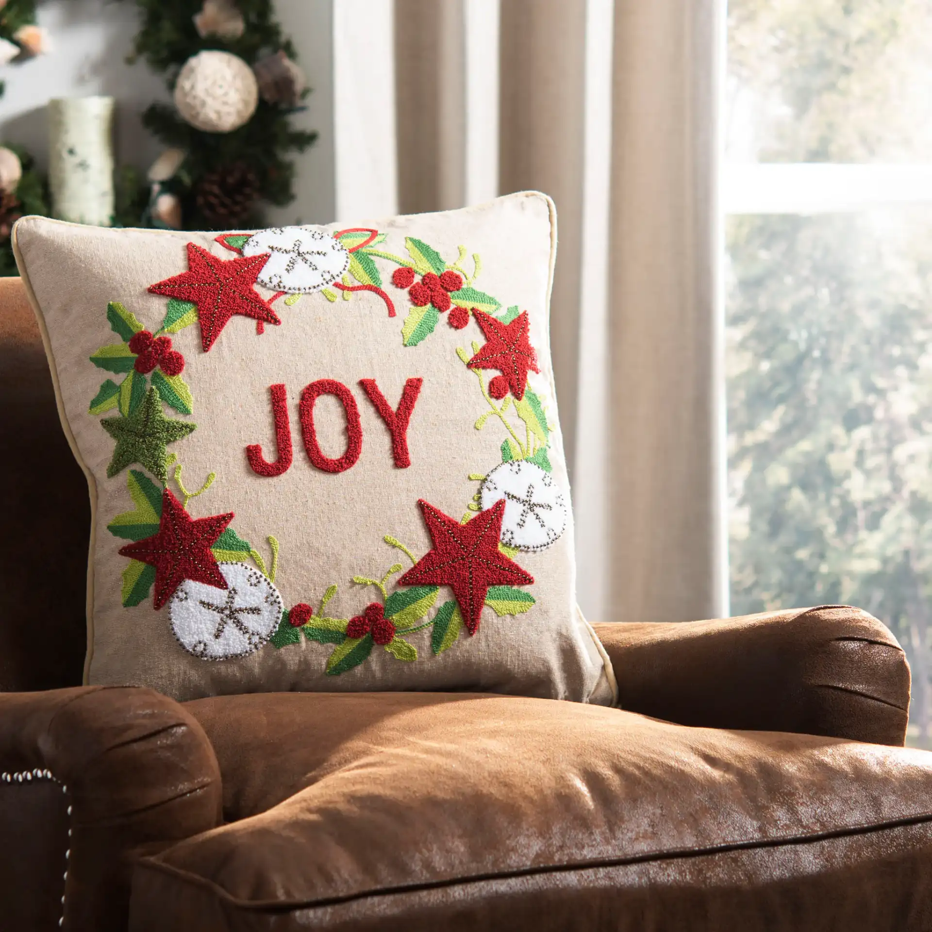Jolly Joy Pillow in Green / Red / Beige in a styled room