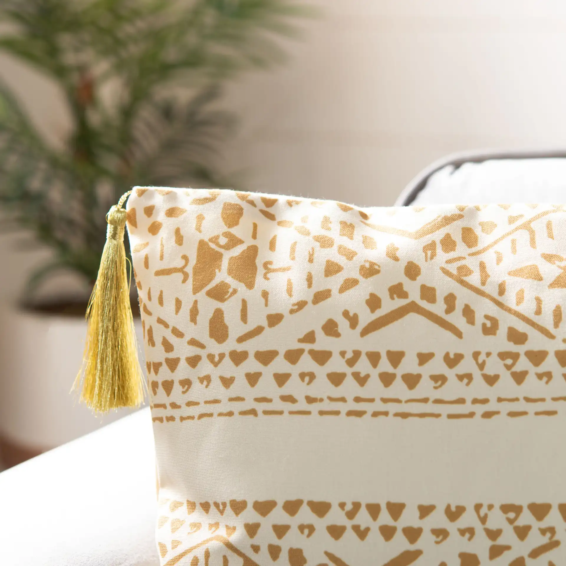 Valen Pillow in Beige / Brown in a styled room