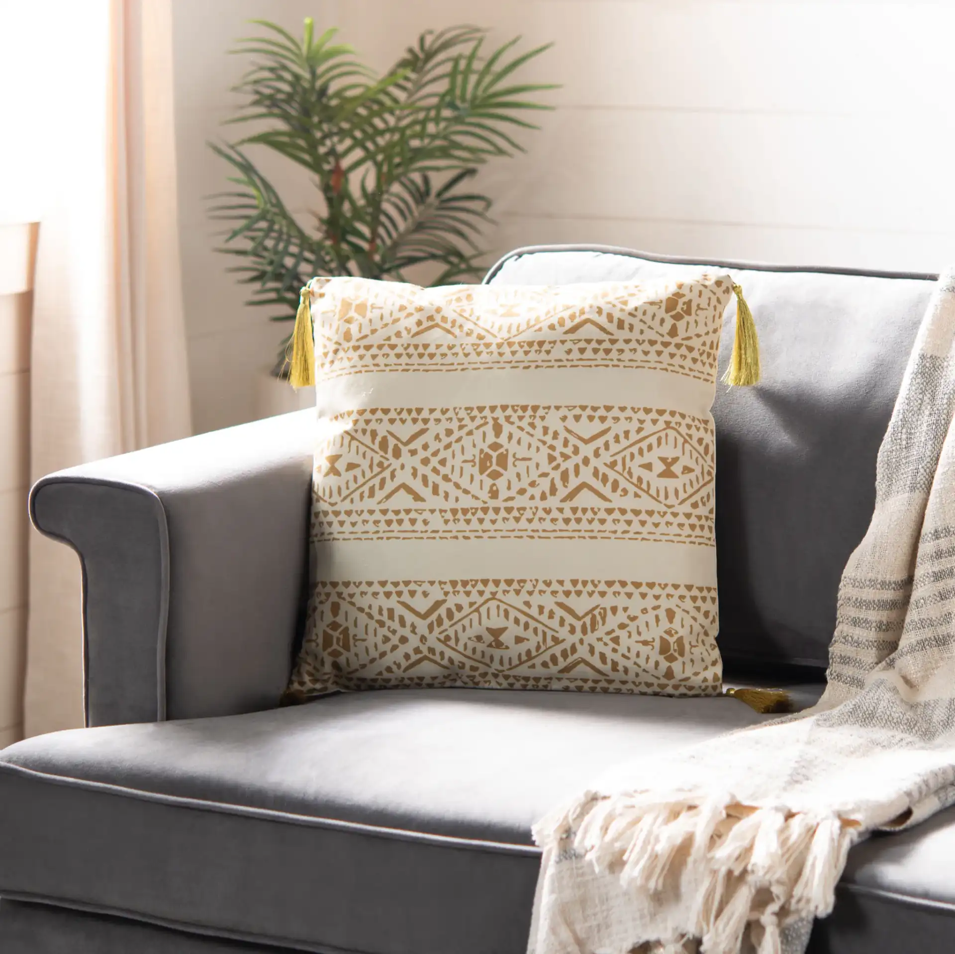 Valen Pillow in Beige / Brown in a styled room