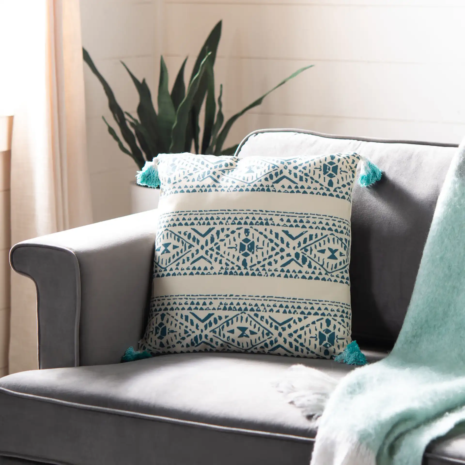 Valen Pillow in Beige / Brown in a styled room