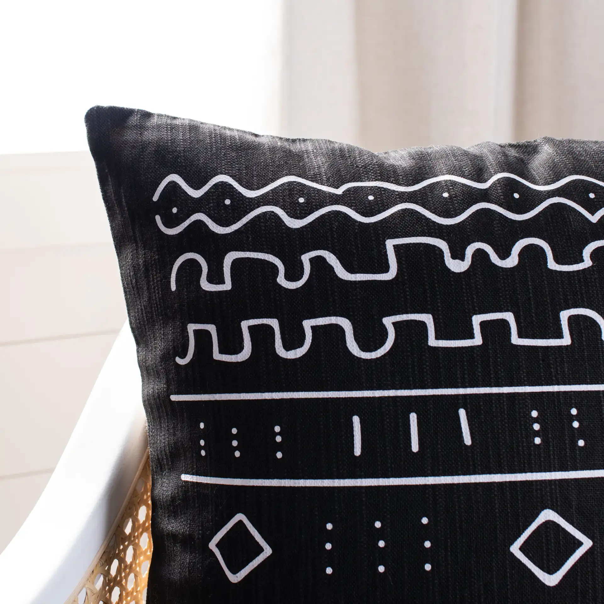 Rila Pillow in Black / White in a styled room