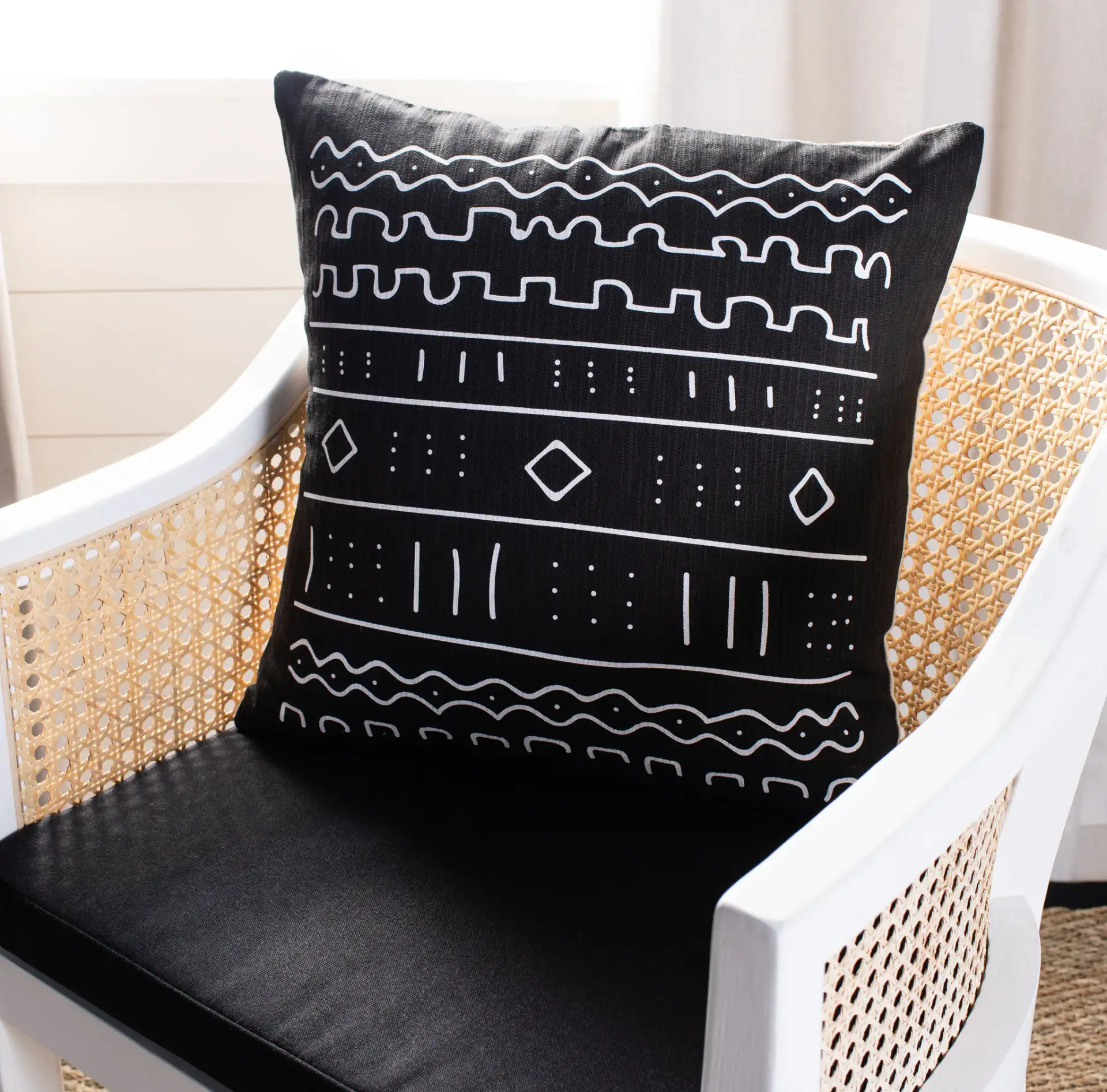 Rila Pillow in Black / White in a styled room