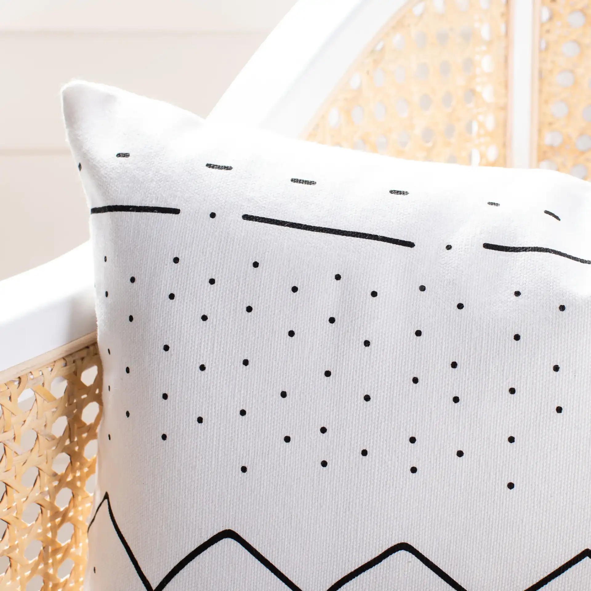 Tari Pillow in Black / White in a styled room