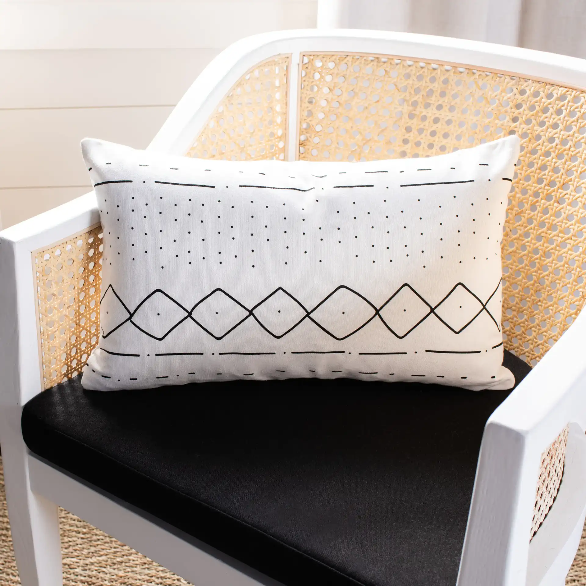 Tari Pillow in Black / White in a styled room
