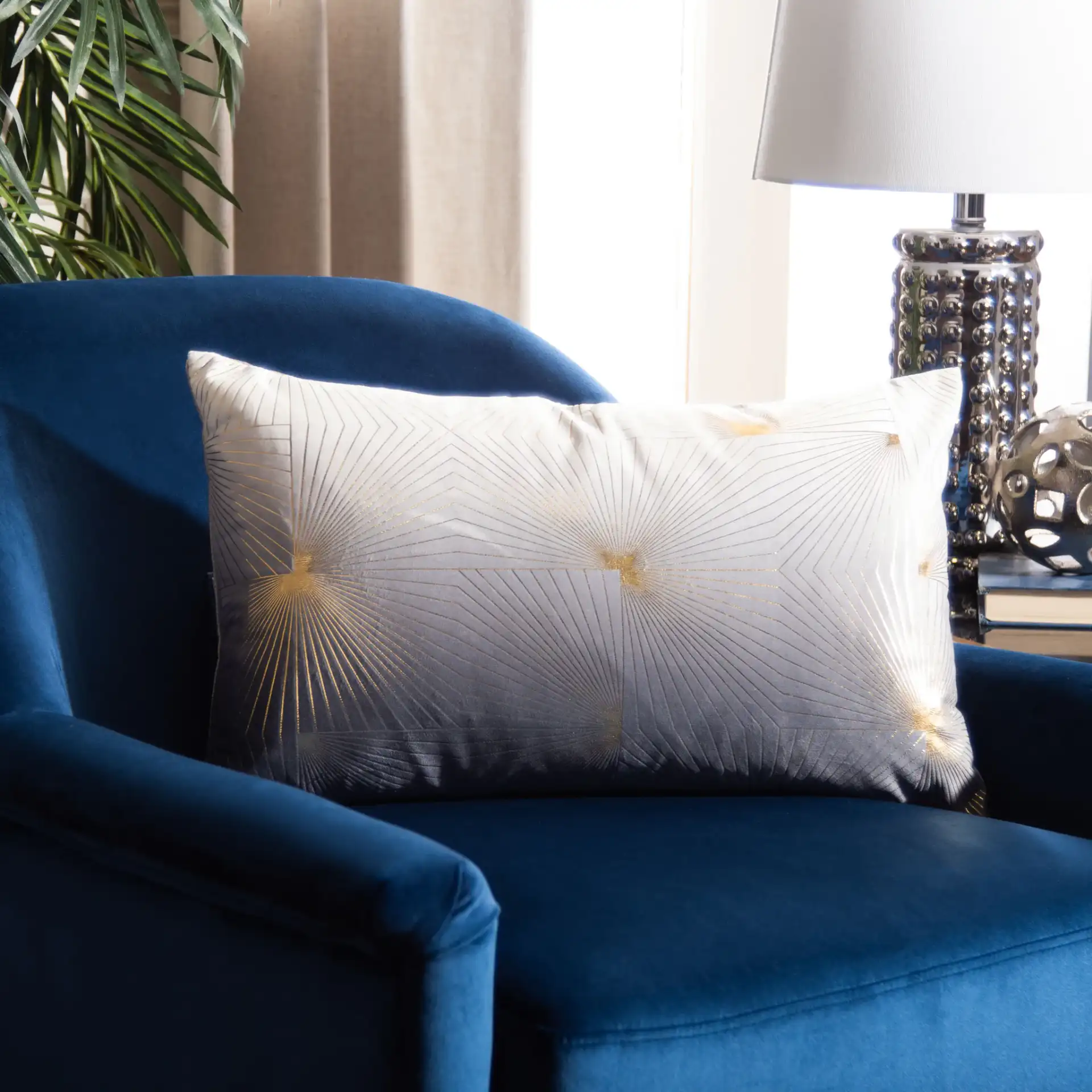Loran Pillow in Gray / Gold in a styled room