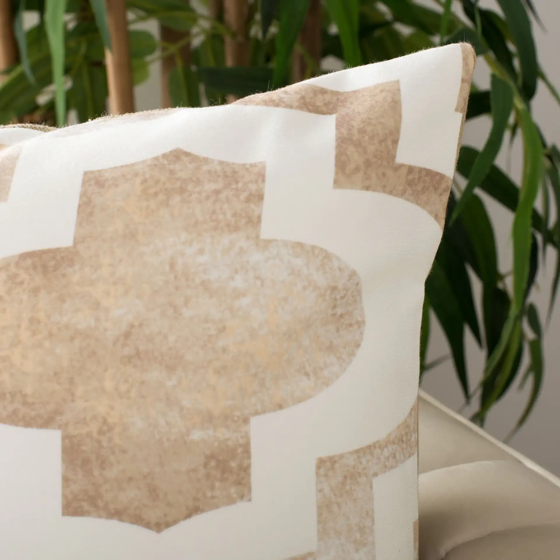 Velie Pillow in Beige / White in a styled room