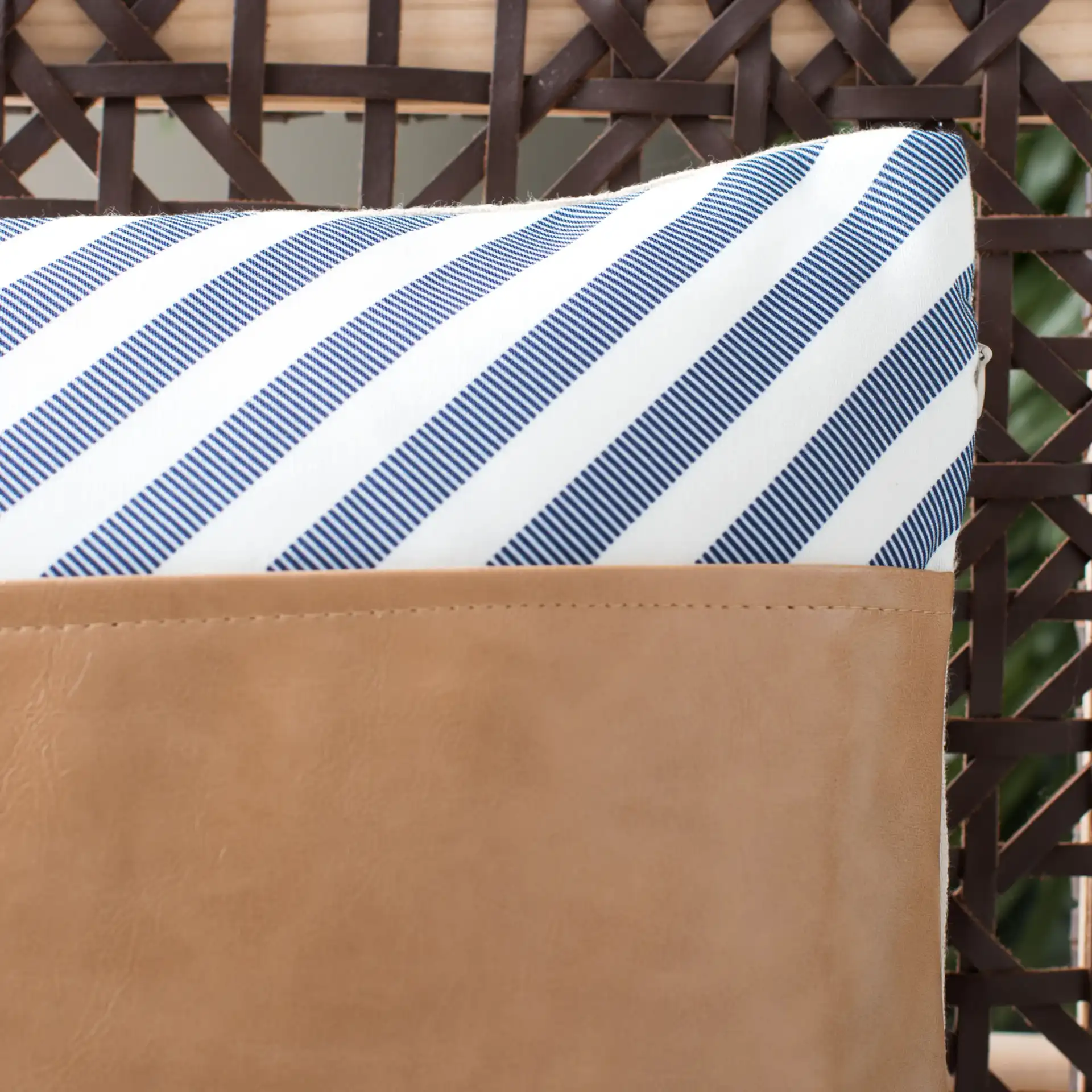 Endra Pillow in Navy / White / Tan in a styled room