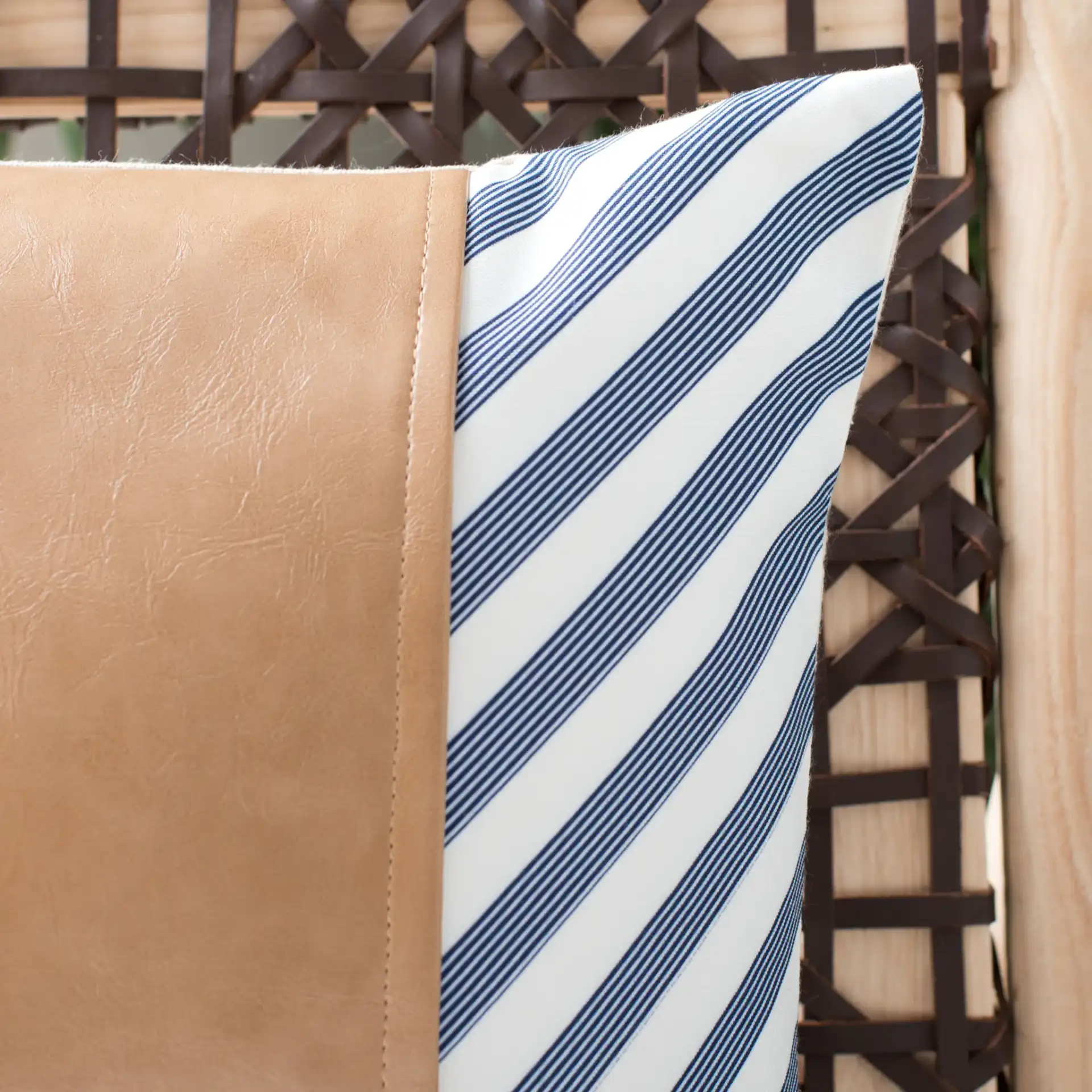 Endra Pillow in Navy / White / Tan in a styled room