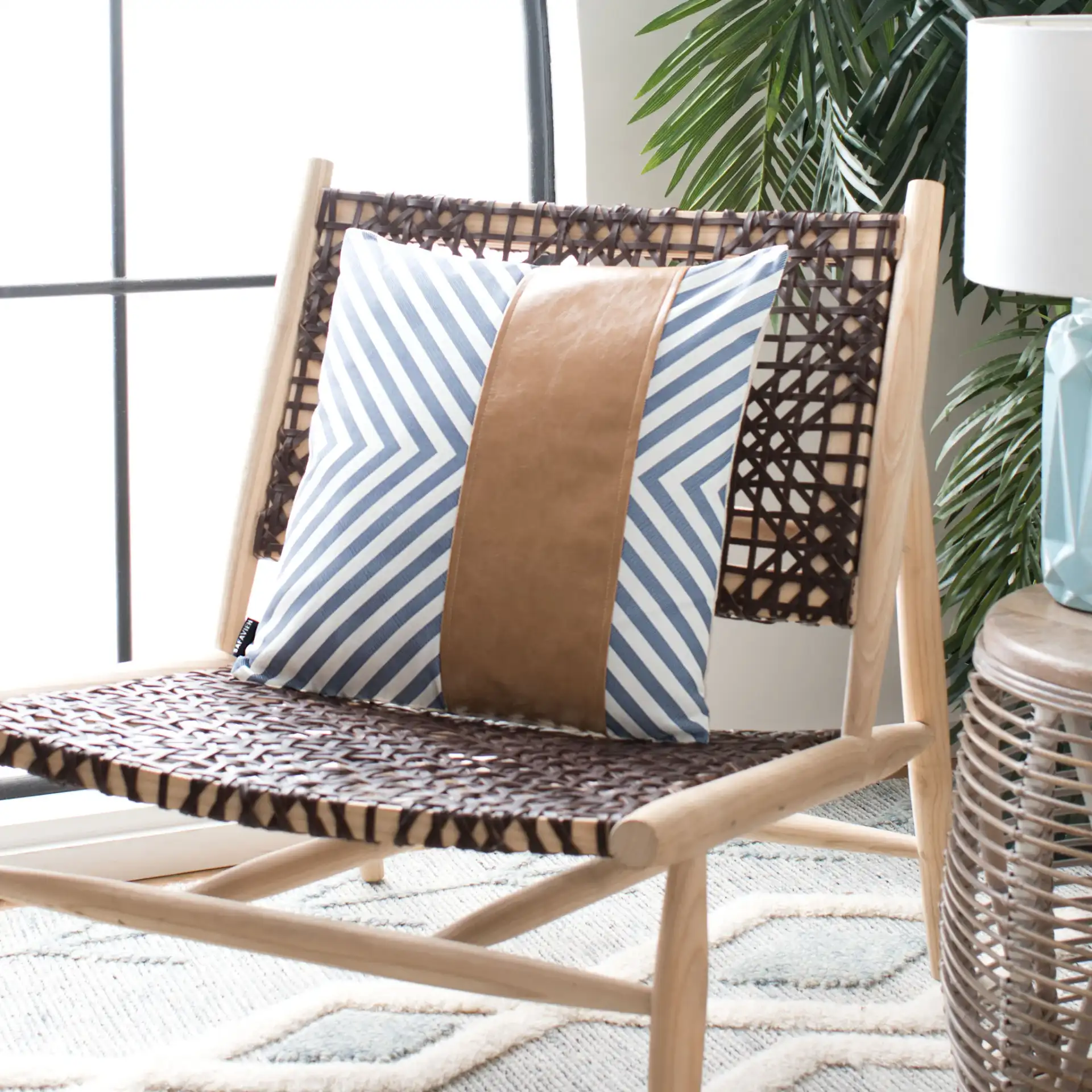 Endra Pillow in Navy / White / Tan in a styled room