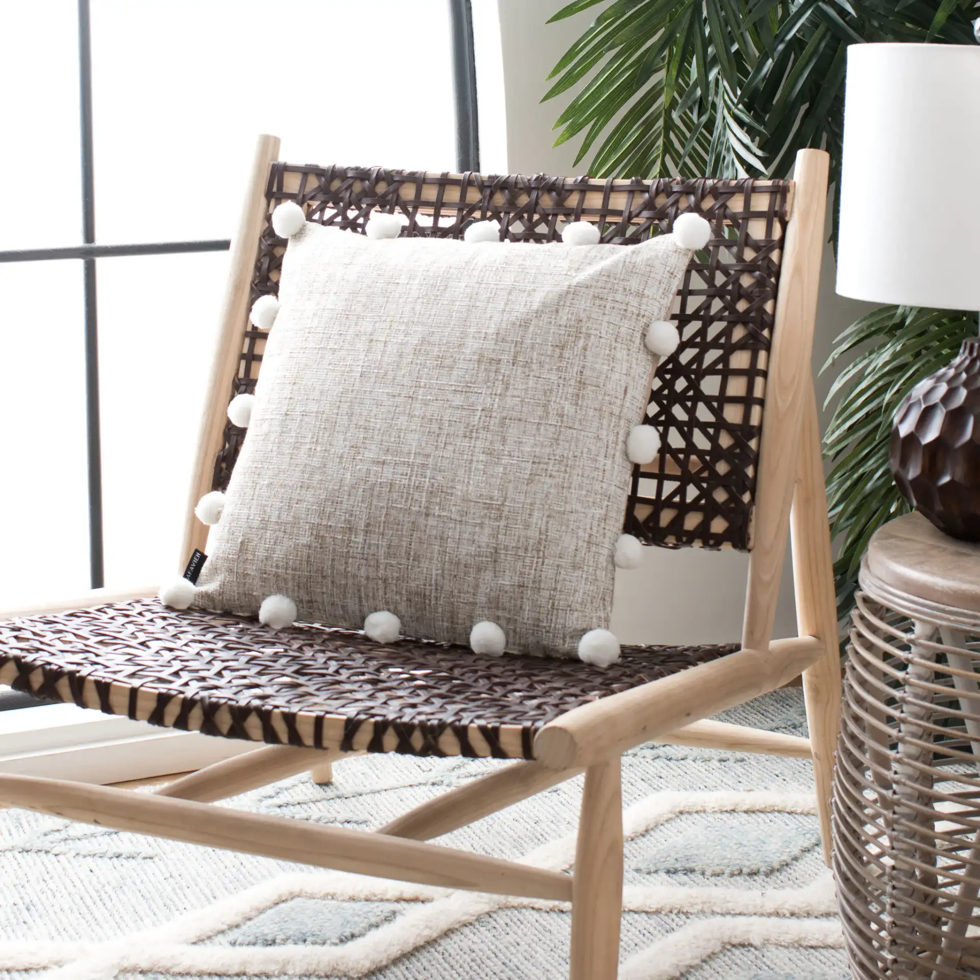 Temi Pillow in Beige / White in a styled room