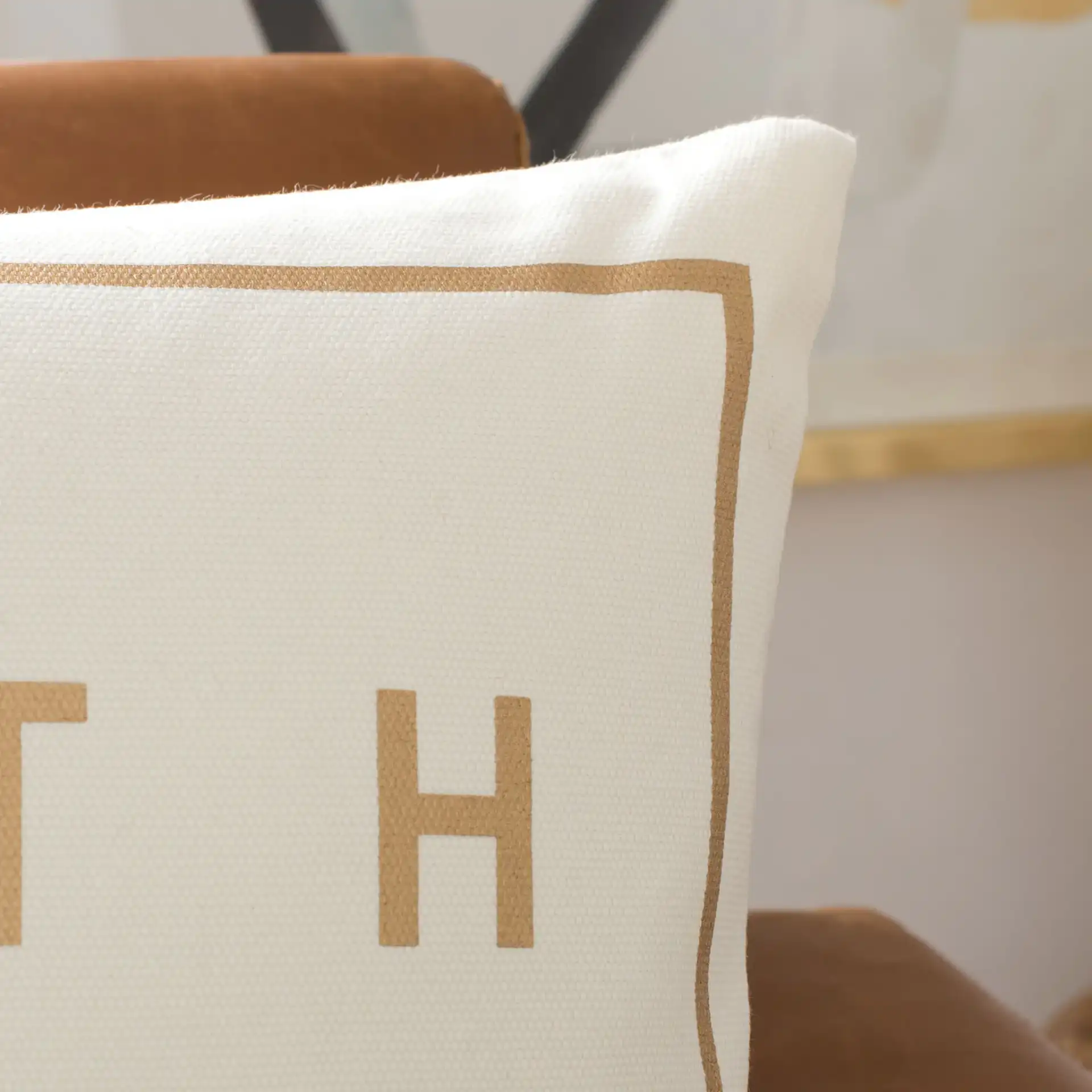 Faith Pillow in Beige / Gold in a styled room