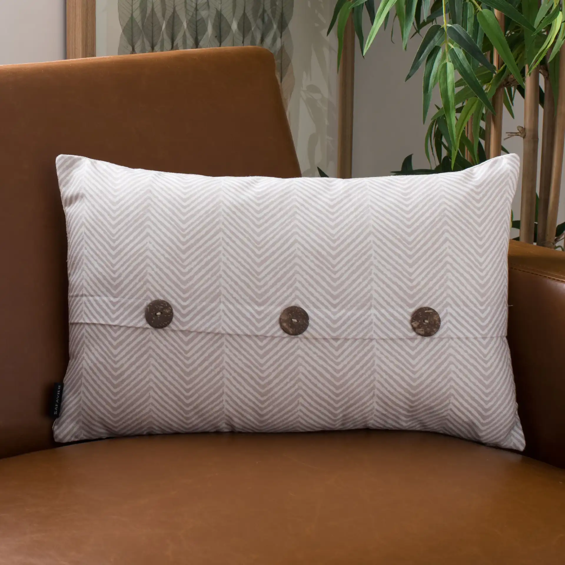Dermi Pillow in Gray / White in a styled room