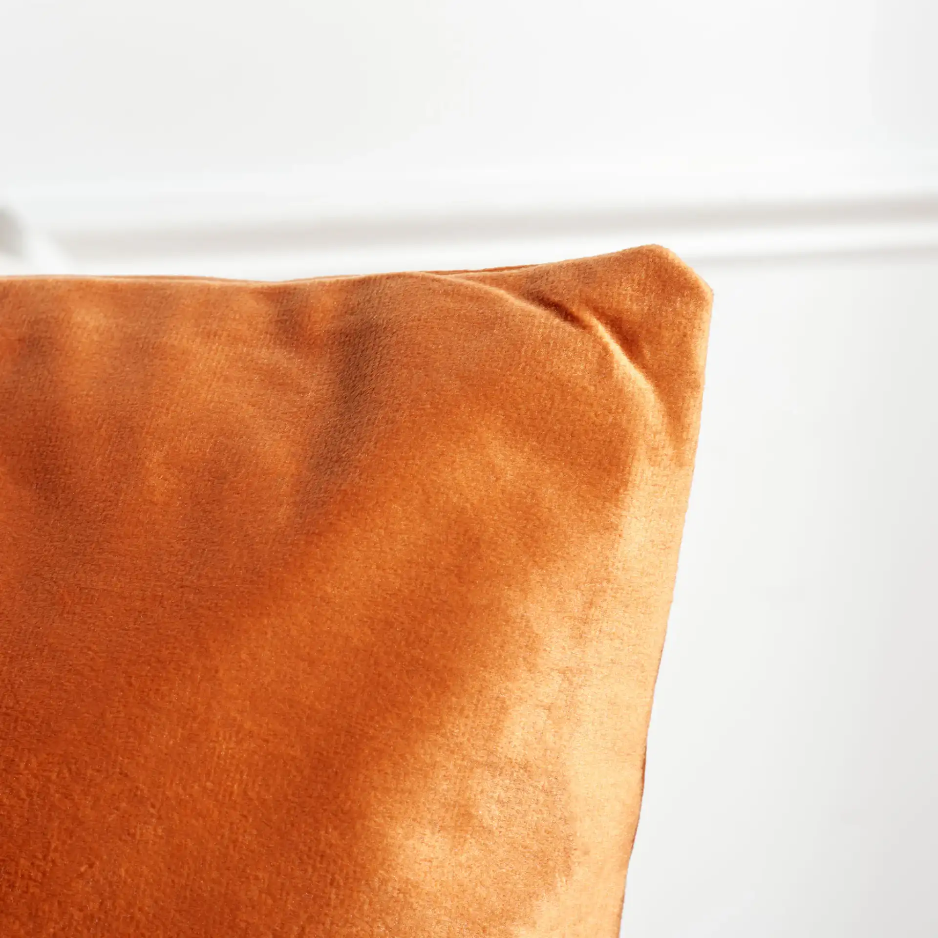 Anaster Pillow in Orange in a styled room