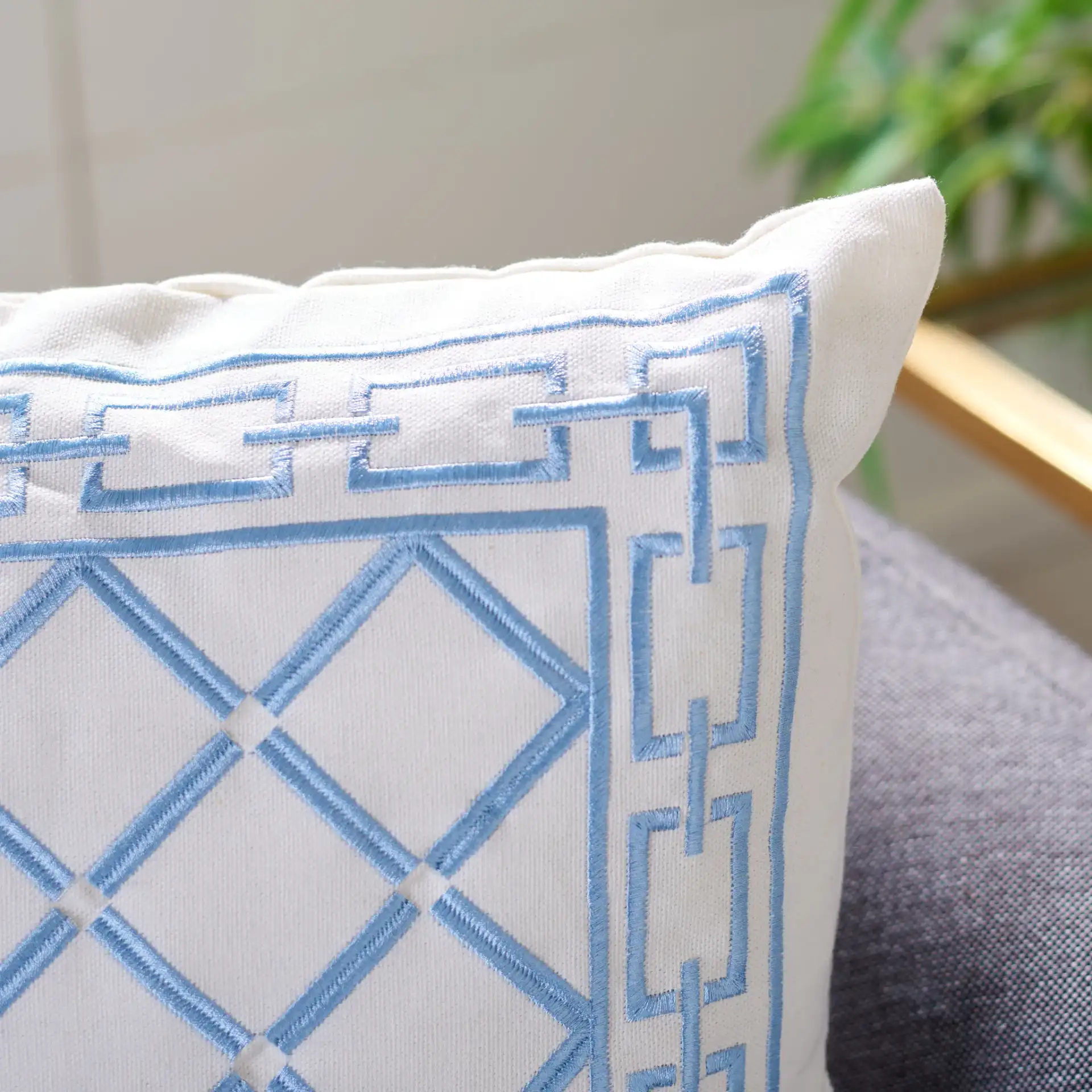 Bentra Pillow in Blue / White in a styled room