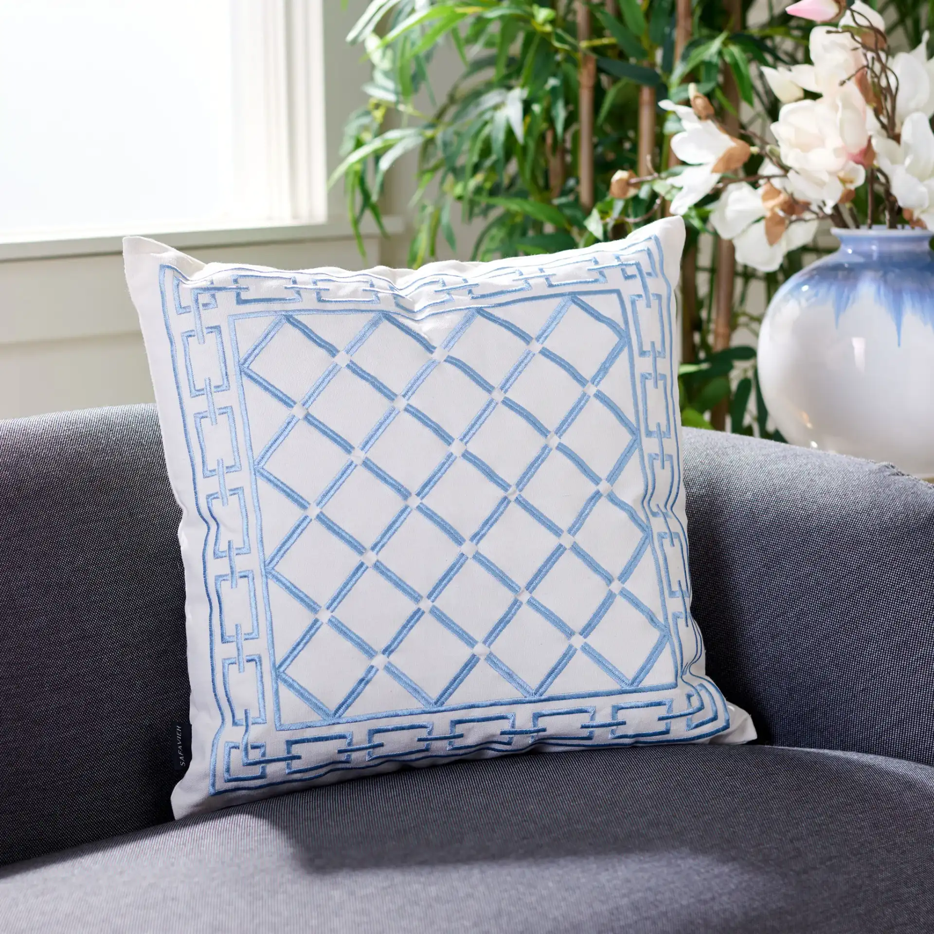 Bentra Pillow in Blue / White in a styled room