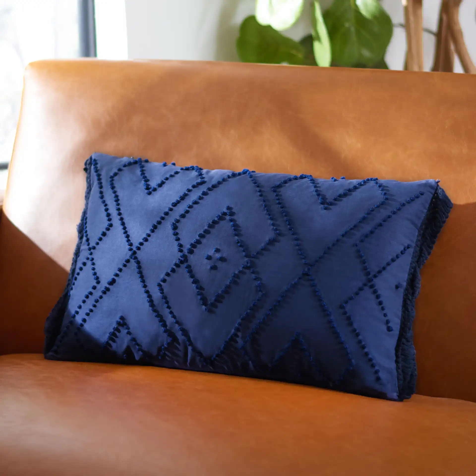 Sorena Pillow in Navy Blue in a styled room