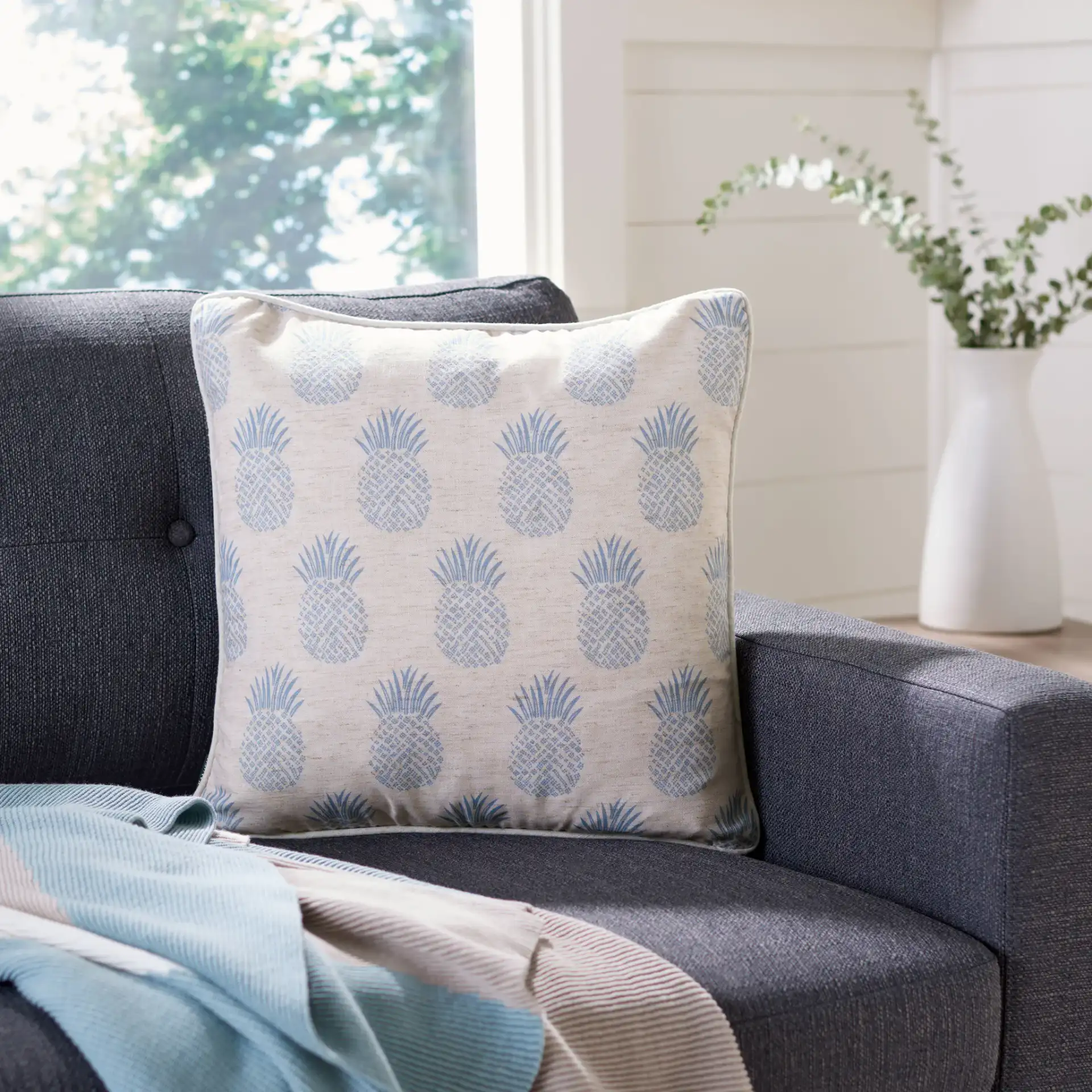 Brillen Pillow in Blue / White in a styled room