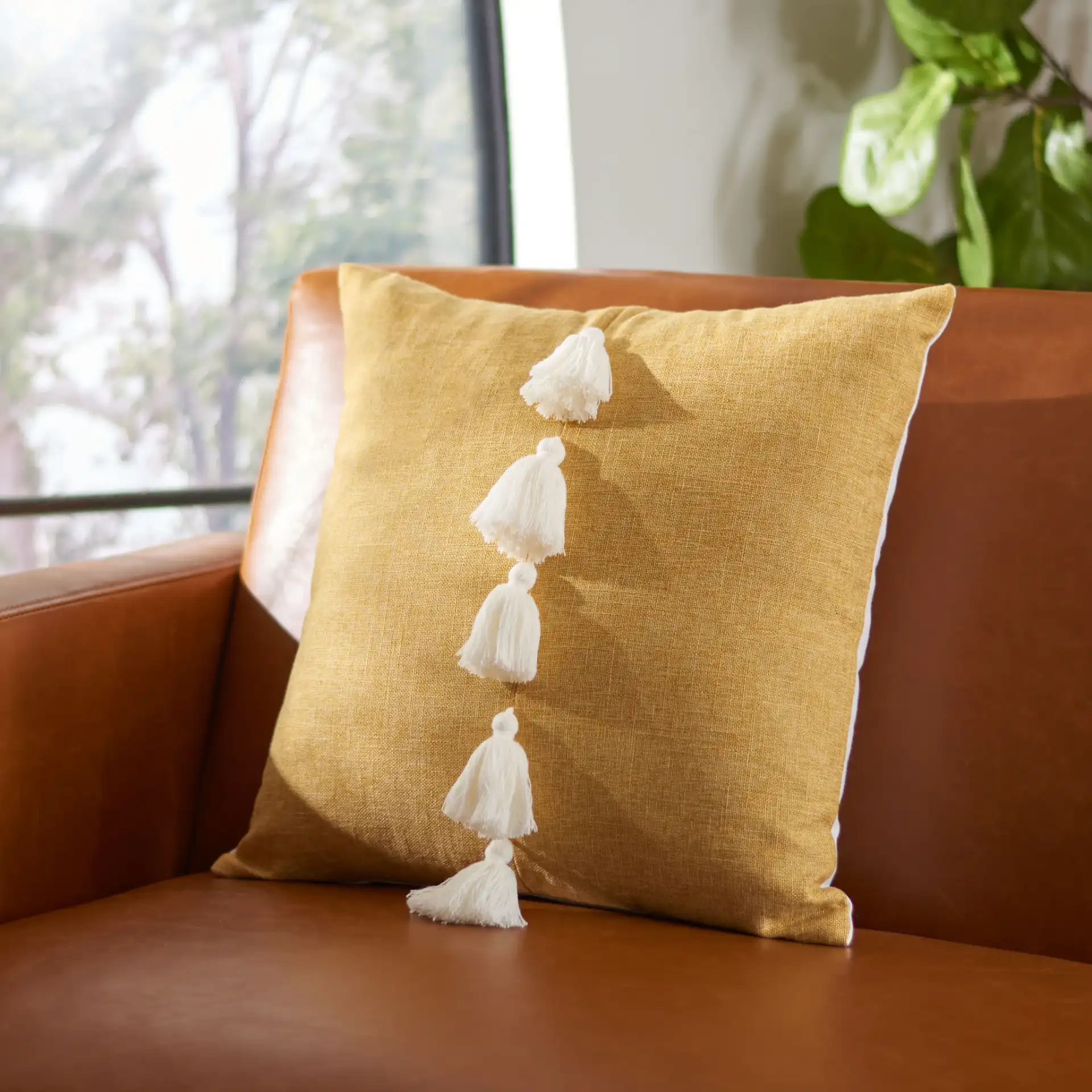 Revra Pillow in Sand in a styled room