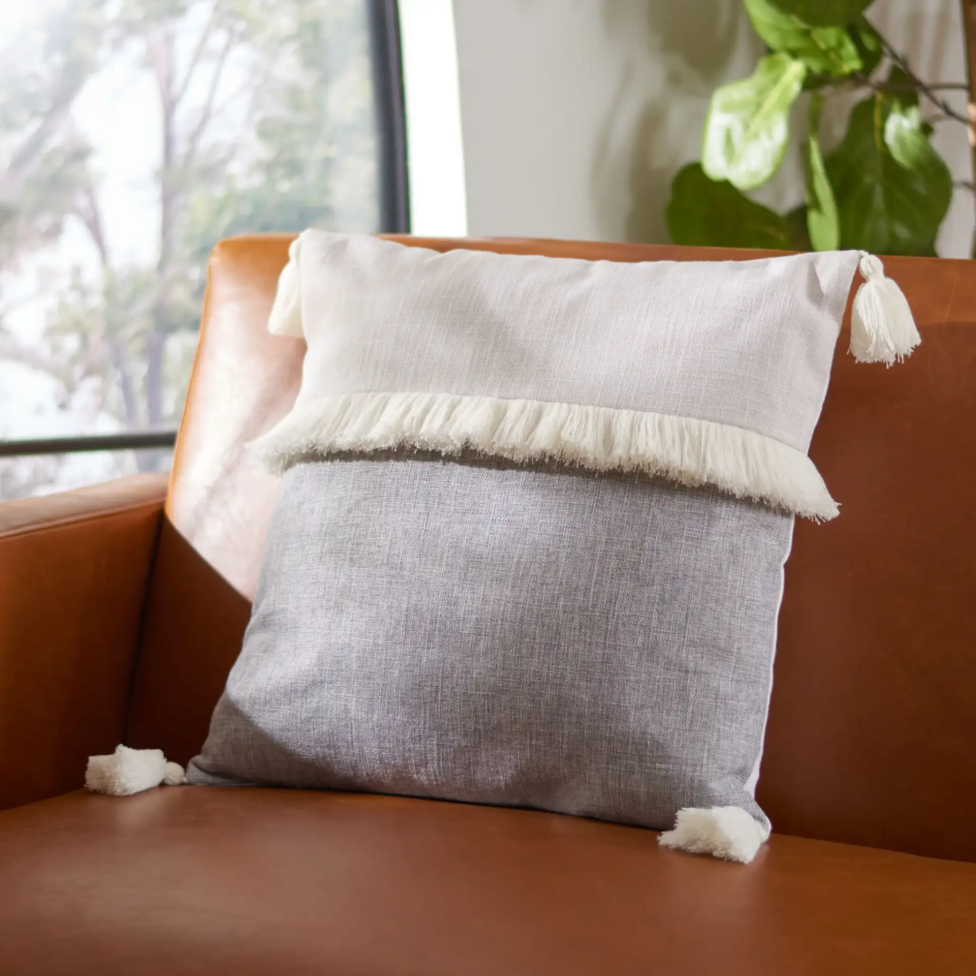 Demli Pillow in Gray / White in a styled room