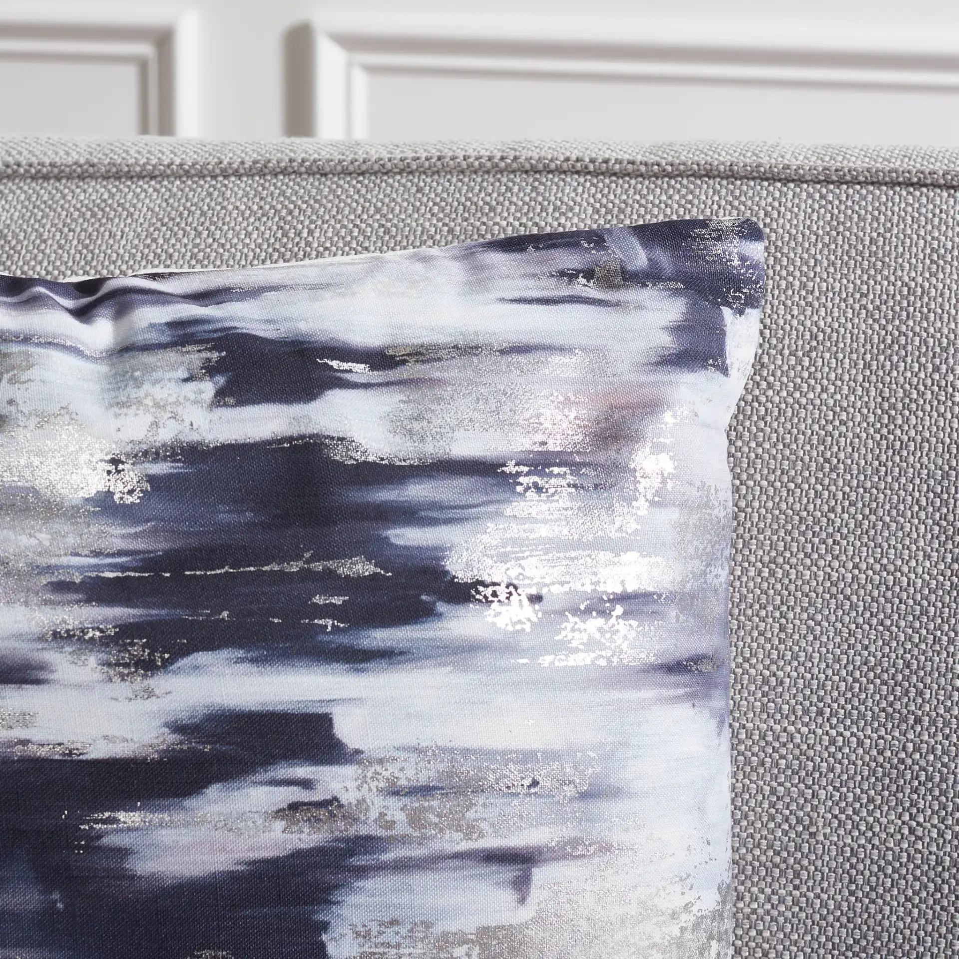 Andrine Pillow in Silver / Navy in a styled room