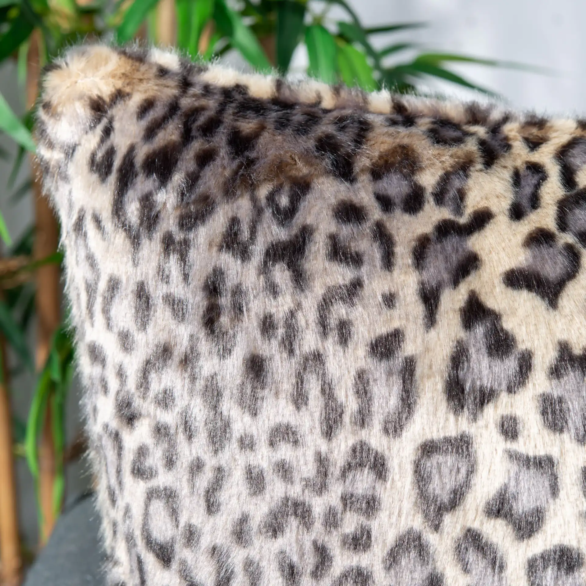 Faux Black Leopard Pillow in Leopard in a styled room