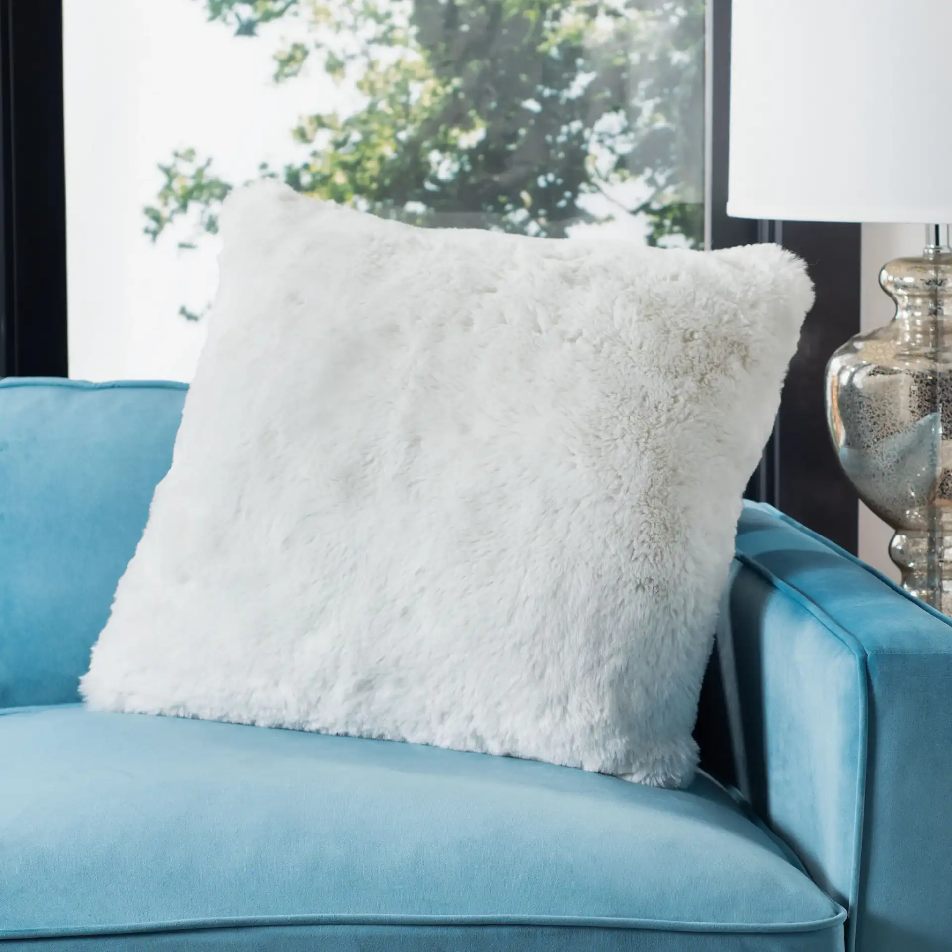 Faux Chinchilla Pillow in Snow White in a styled room